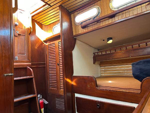 Interior of a 1975 Salar 40 sailboat with wooden furnishings and cozy cabin space.