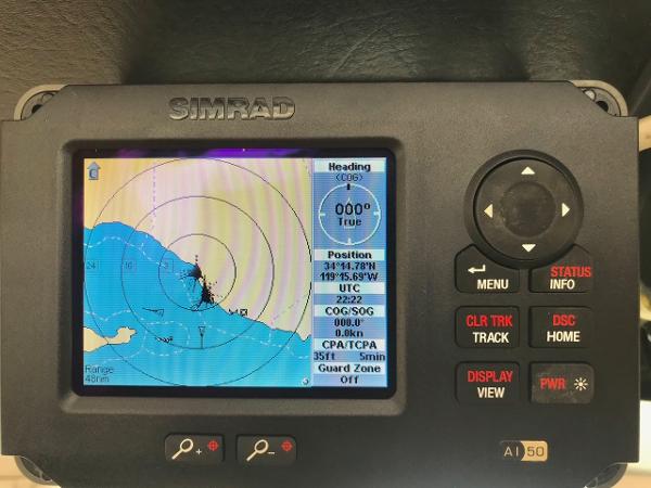 Simrad marine GPS display showing navigation data and map, on a 1975 Salar 40 boat.