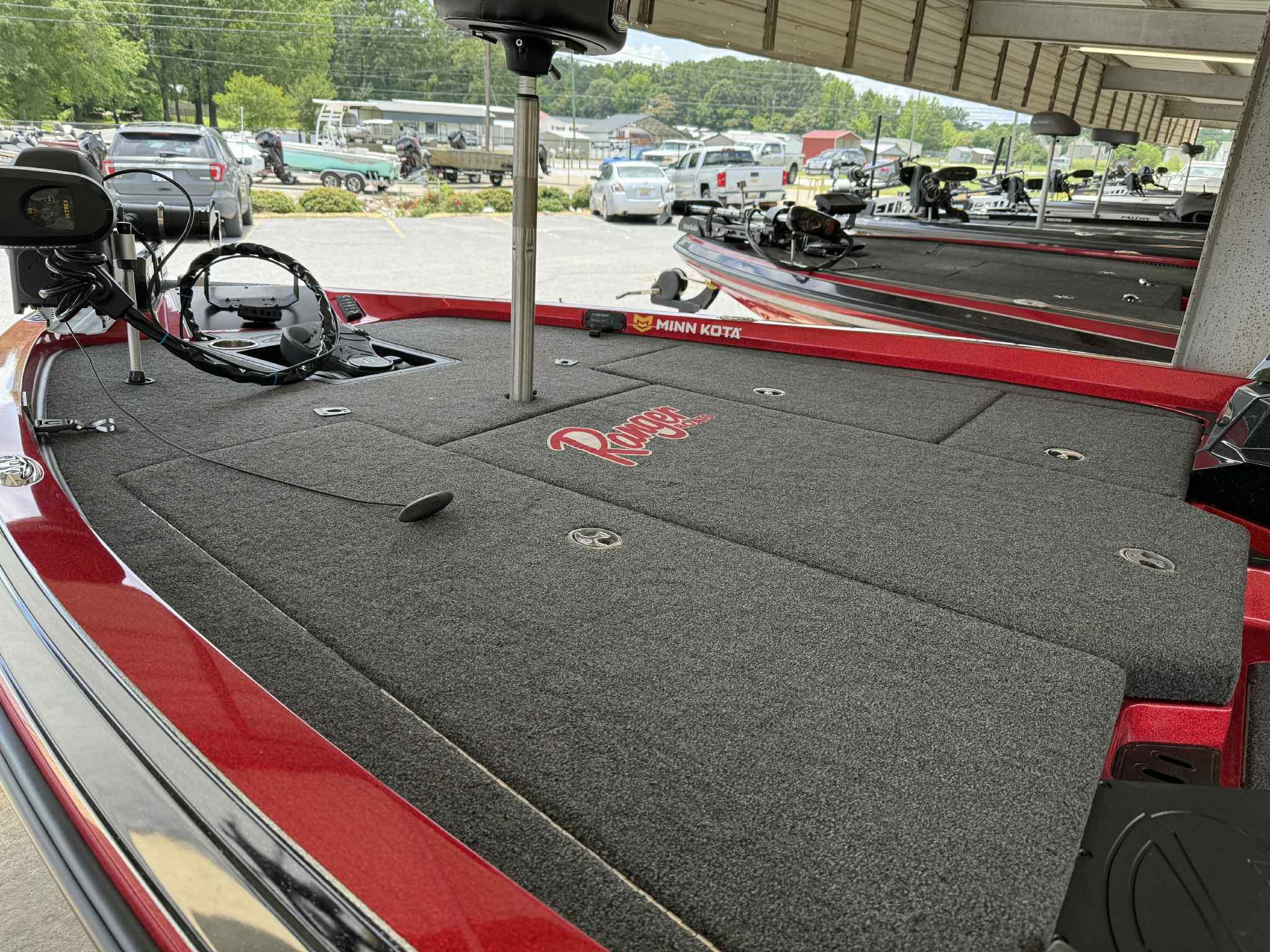 2022 Ranger Z518 boat deck with Minn Kota trolling motor in a parking area.