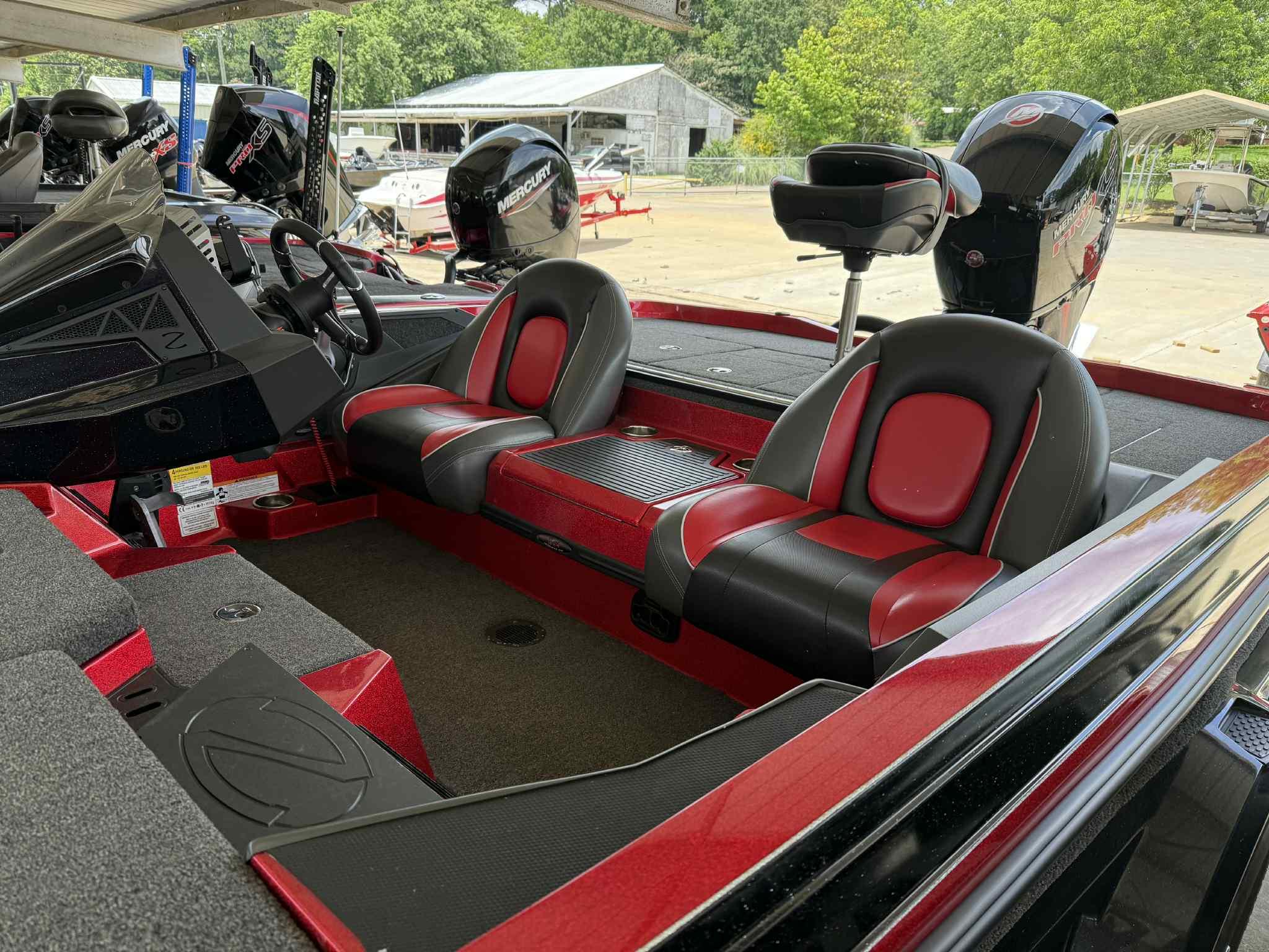 2022 Ranger Z518 boat interior with red and black seats, dual Mercury engines.