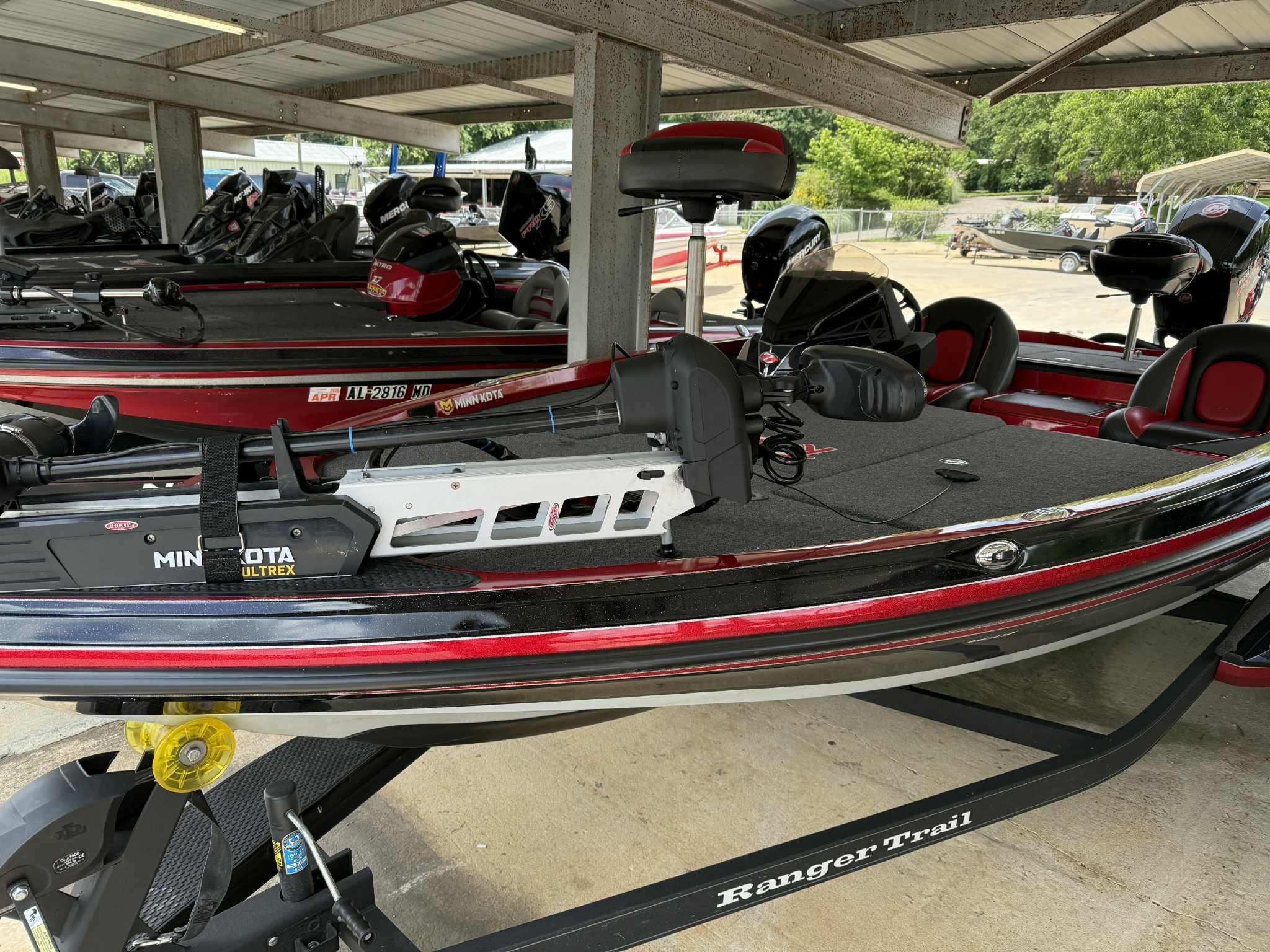 2022 Ranger Z518 boat with Minn Kota Ultrex motor in a covered storage area.