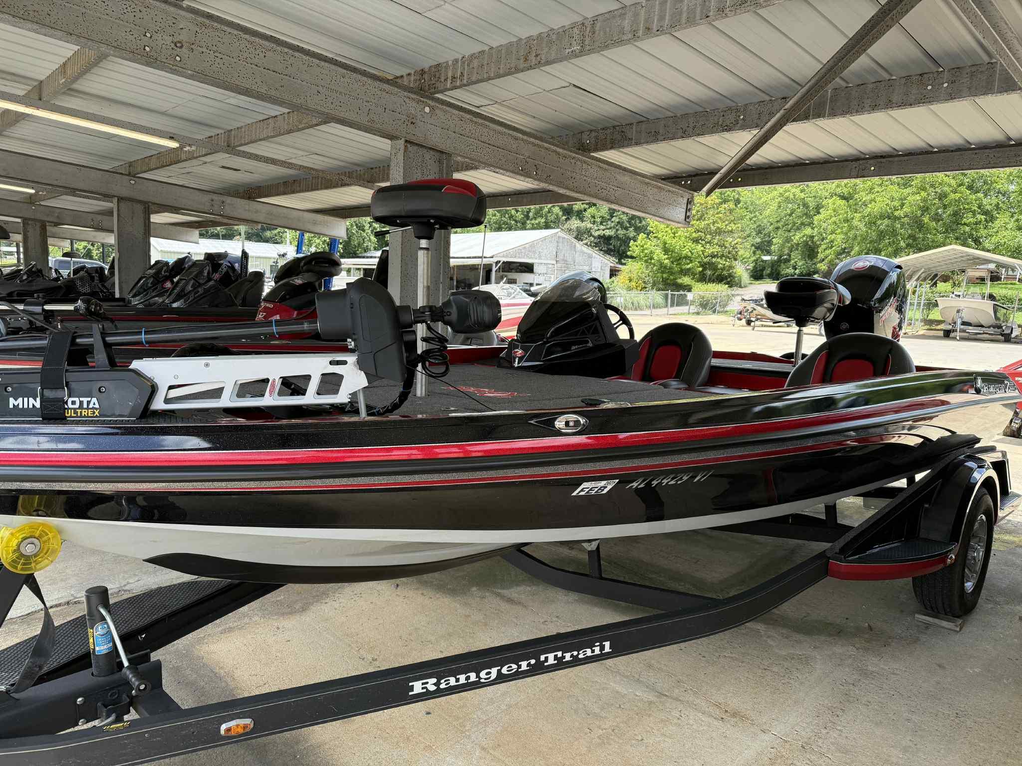 2022 Ranger Z518 boat with Minn Kota Ultrex motor in covered storage.