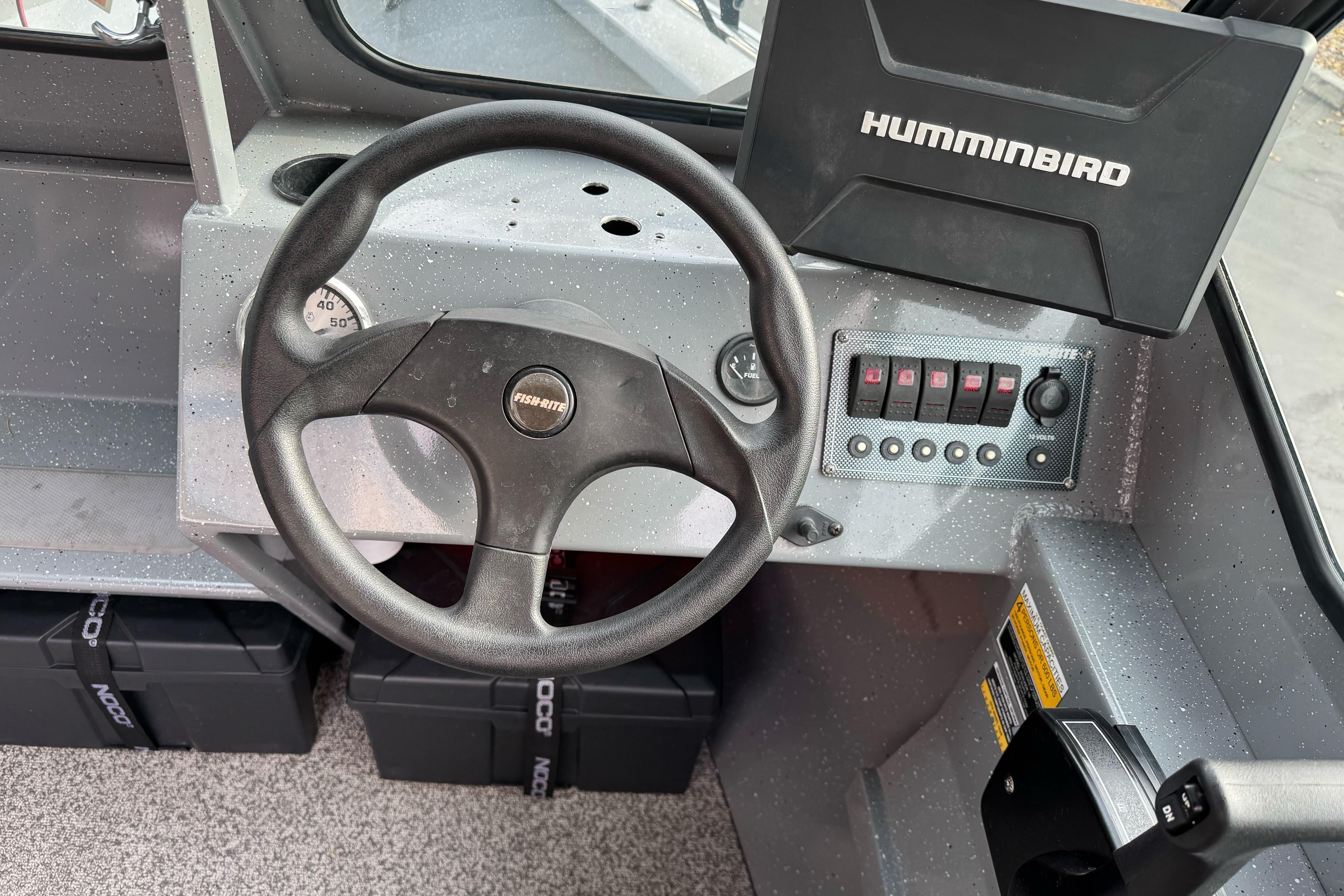2018 Fish Rite 16.5 Stalker boat dashboard with steering wheel and Humminbird device.