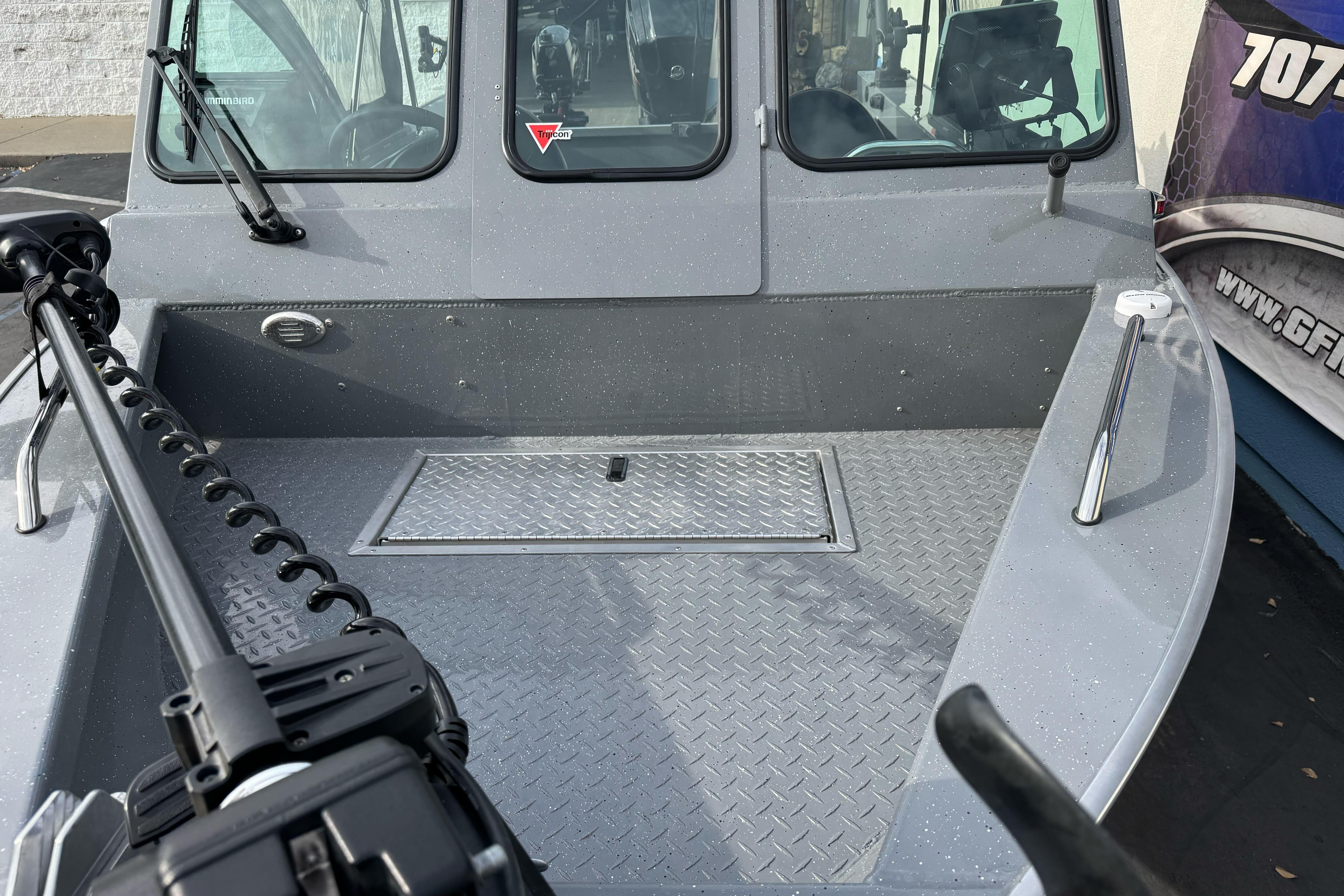 2018 Fish Rite 16.5 Stalker boat with diamond plate deck and windshield.