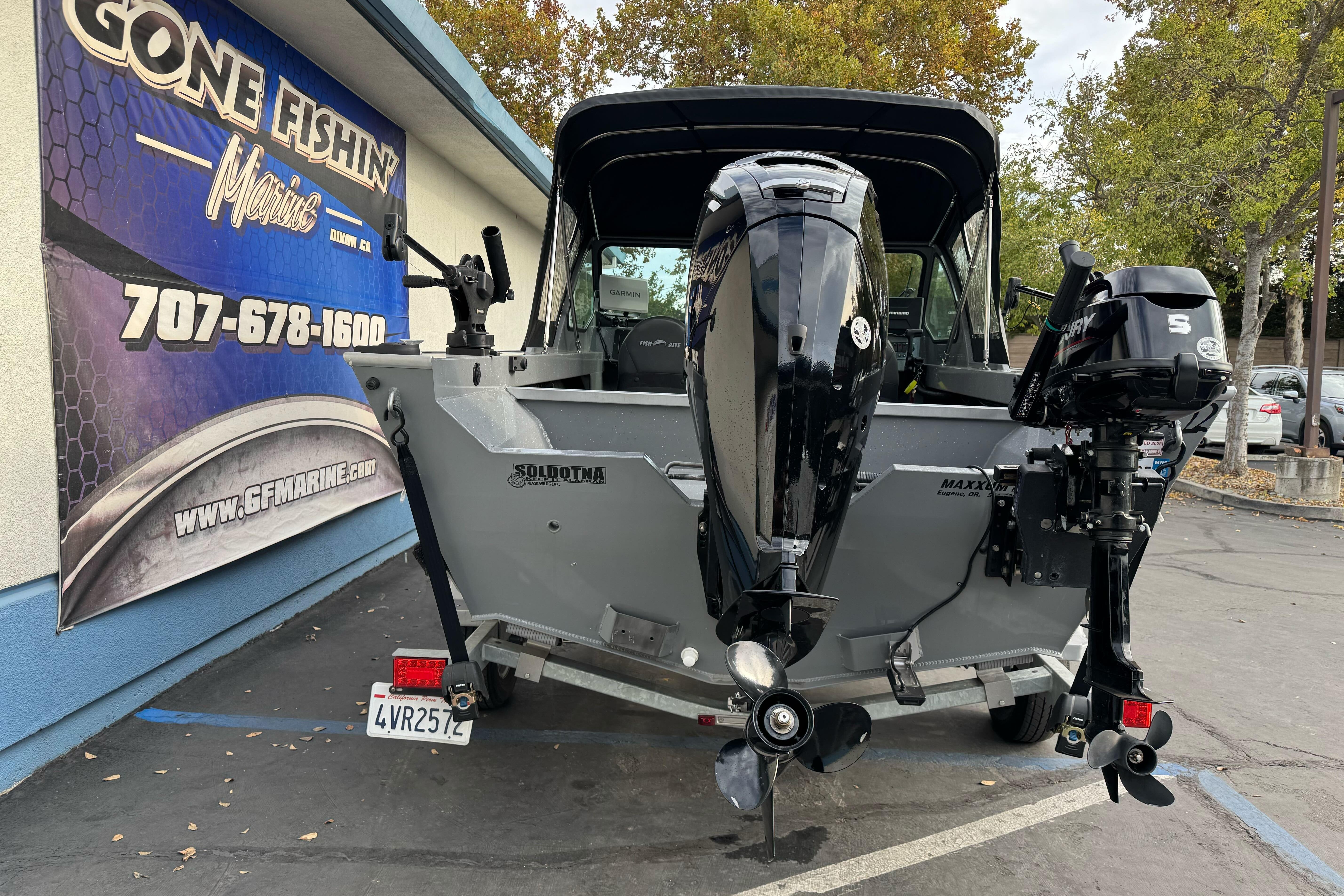 2018 Fish Rite 16.5 Stalker boat with dual outboard motors at dealership.