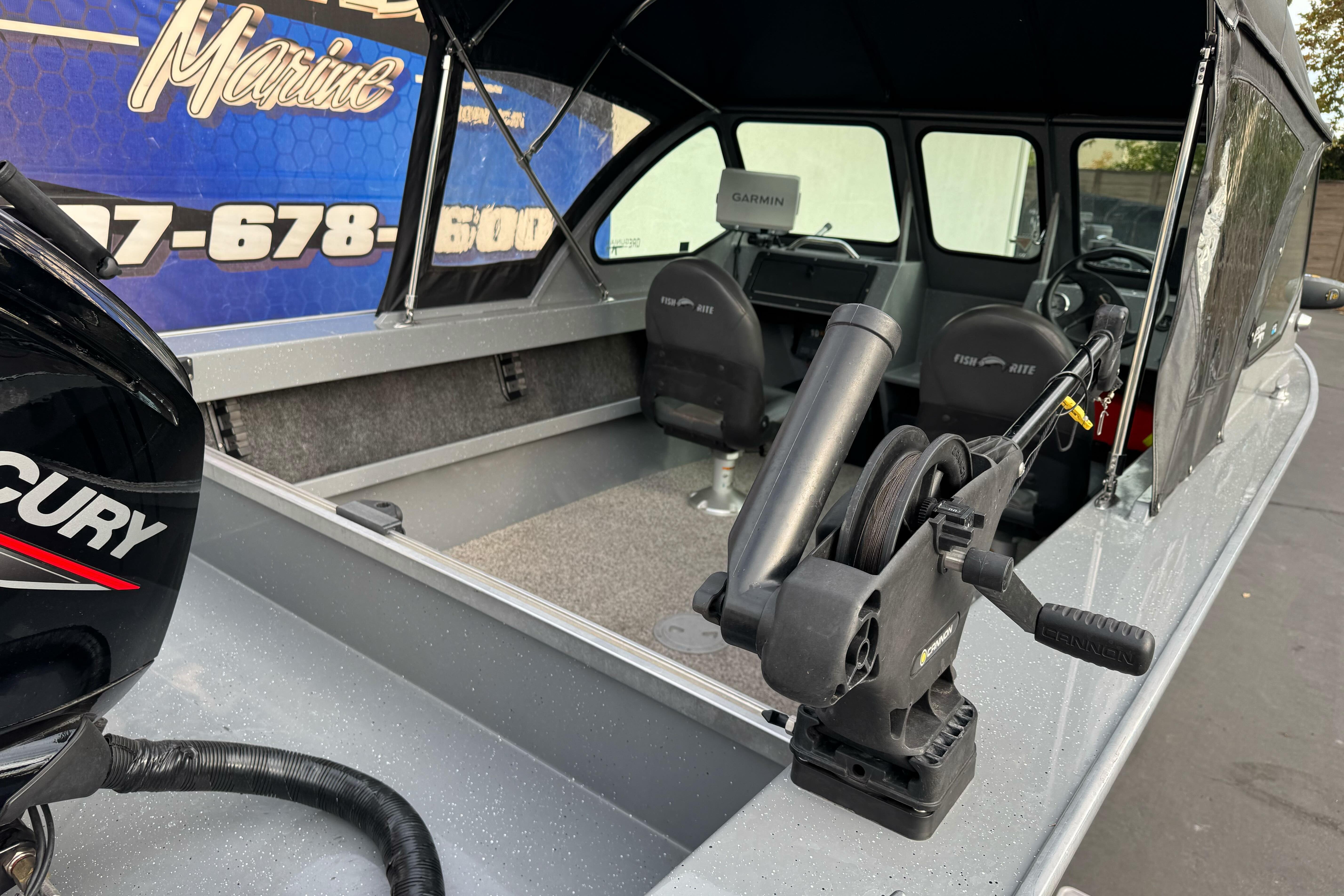 2018 Fish Rite 16.5 Stalker boat interior with Mercury engine and fishing equipment.