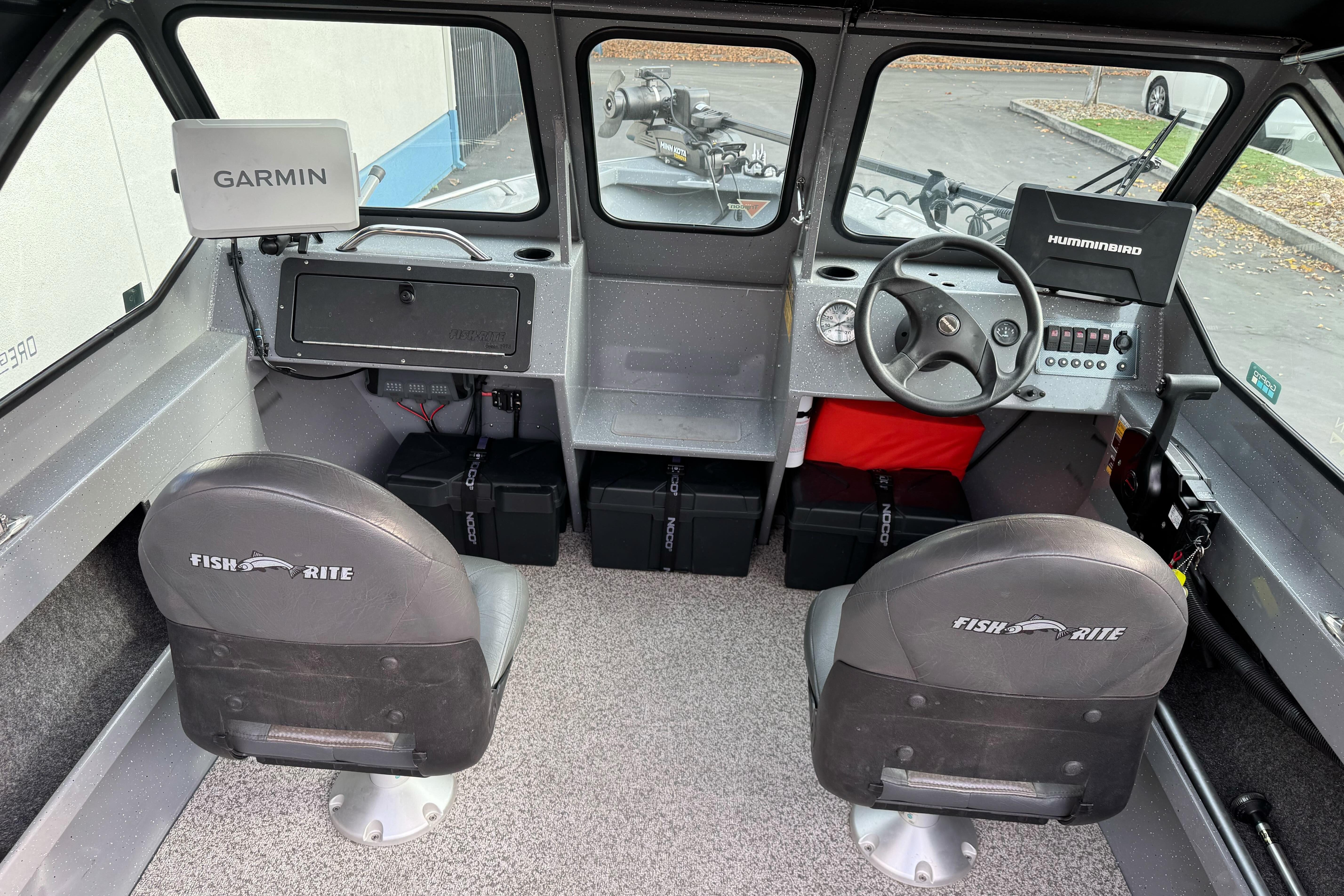 Interior of a 2018 Fish Rite 16.5 Stalker boat with Garmin and Humminbird electronics.