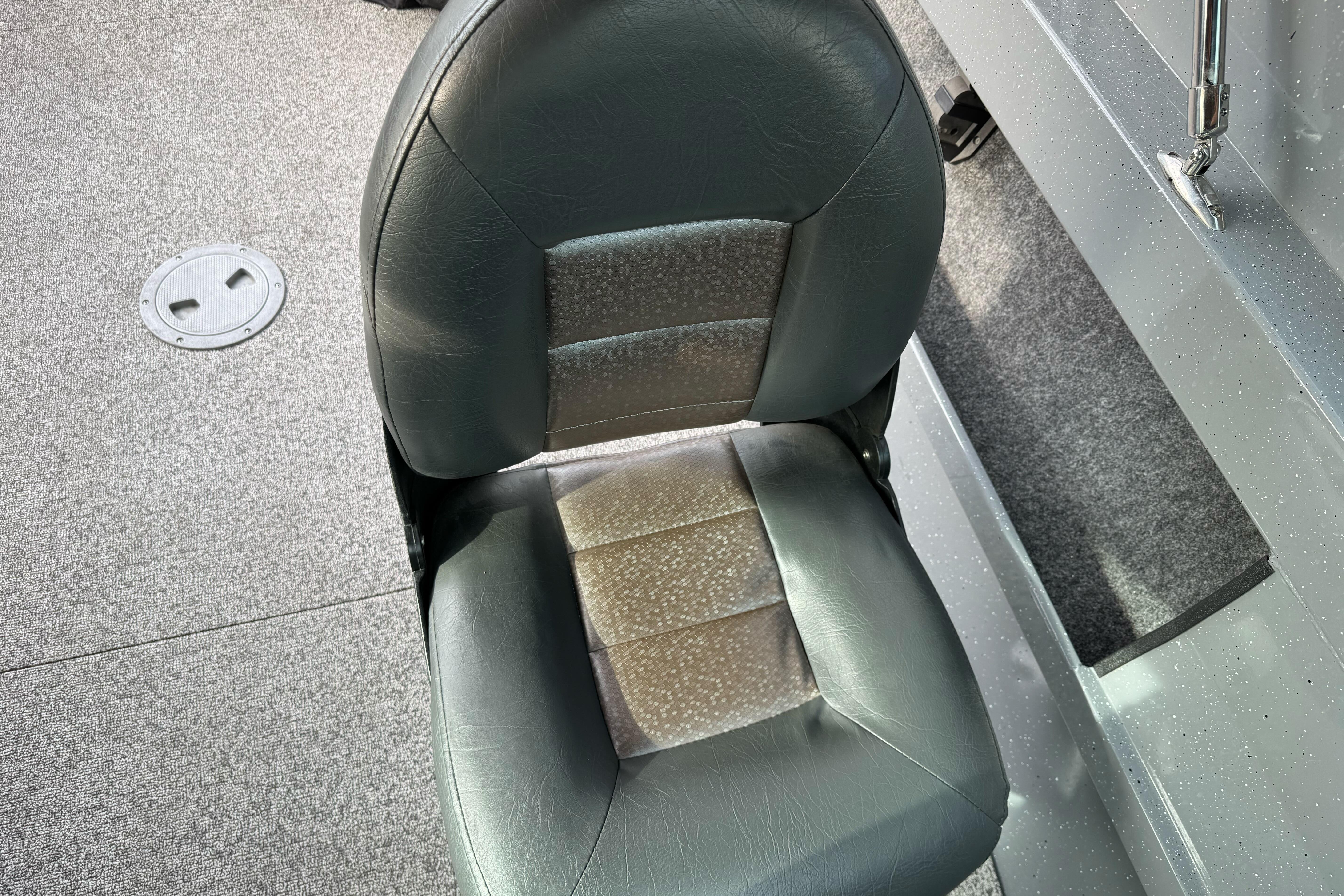 2018 Fish Rite 16.5 Stalker boat seat, gray upholstery, carpeted floor.