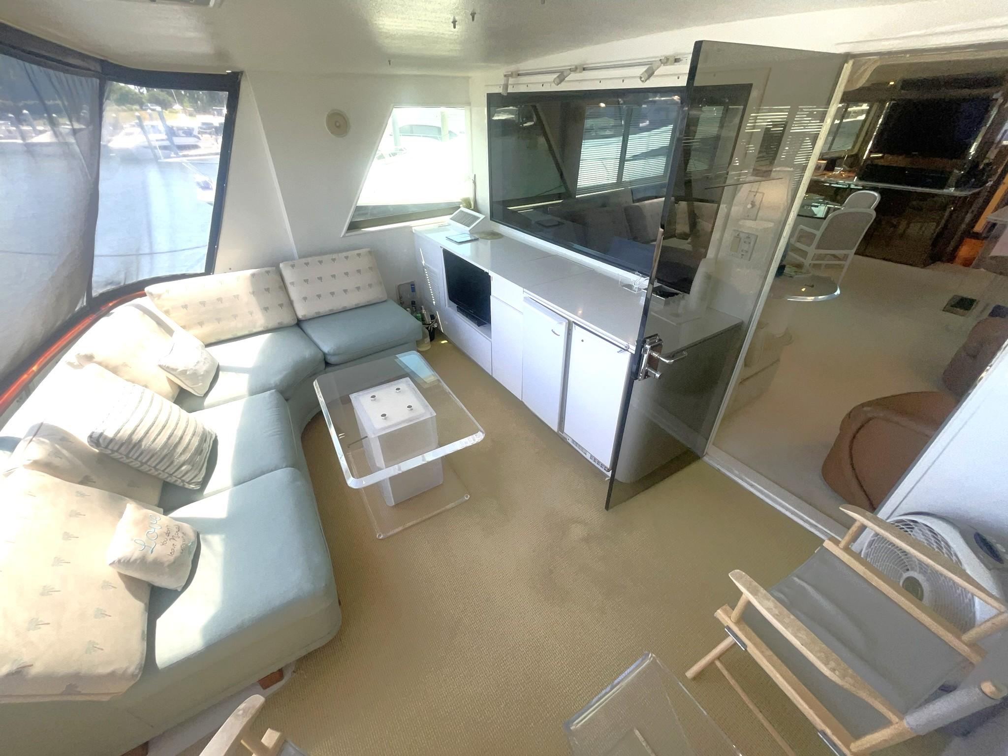 Hatteras-80 Cockpit Motor Yacht 1989-GENTLE BEN VA-US-CLIMATE CONTROLLED AFT DECK LOOKING TO PORT W/WETBAR & ENTERTAINMENT-9784968 | Thumbnail