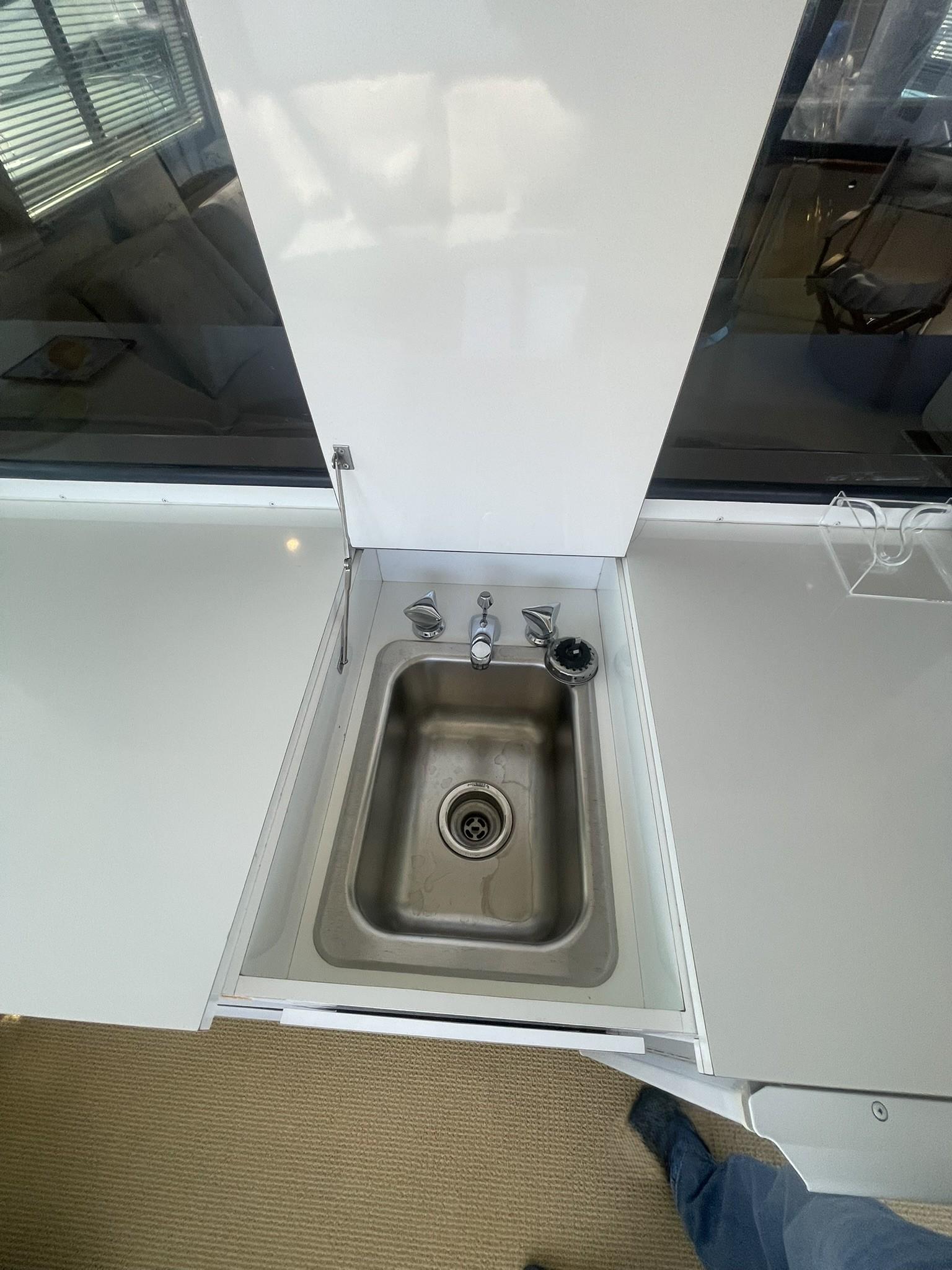 Hatteras-80 Cockpit Motor Yacht 1989-GENTLE BEN VA-US-AFT DECK WETBAR RECESSED SS SINK-9784968 | Thumbnail
