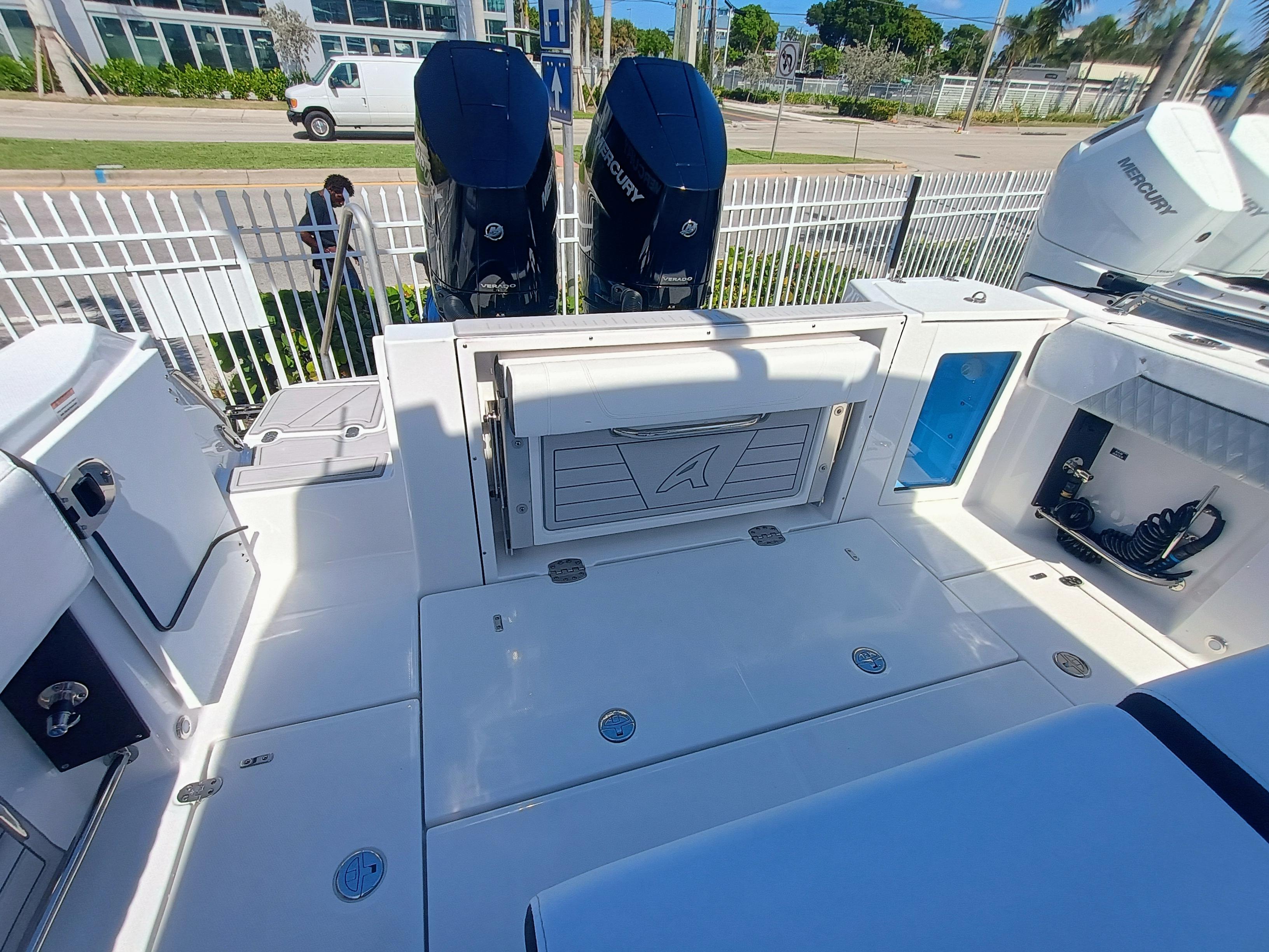 Picture of 332-299 Blackfin 35.83 ft' 332 CC 2025 Blackfin 332 CC boat deck with dual Mercury engines, showcasing modern design and functionality. 