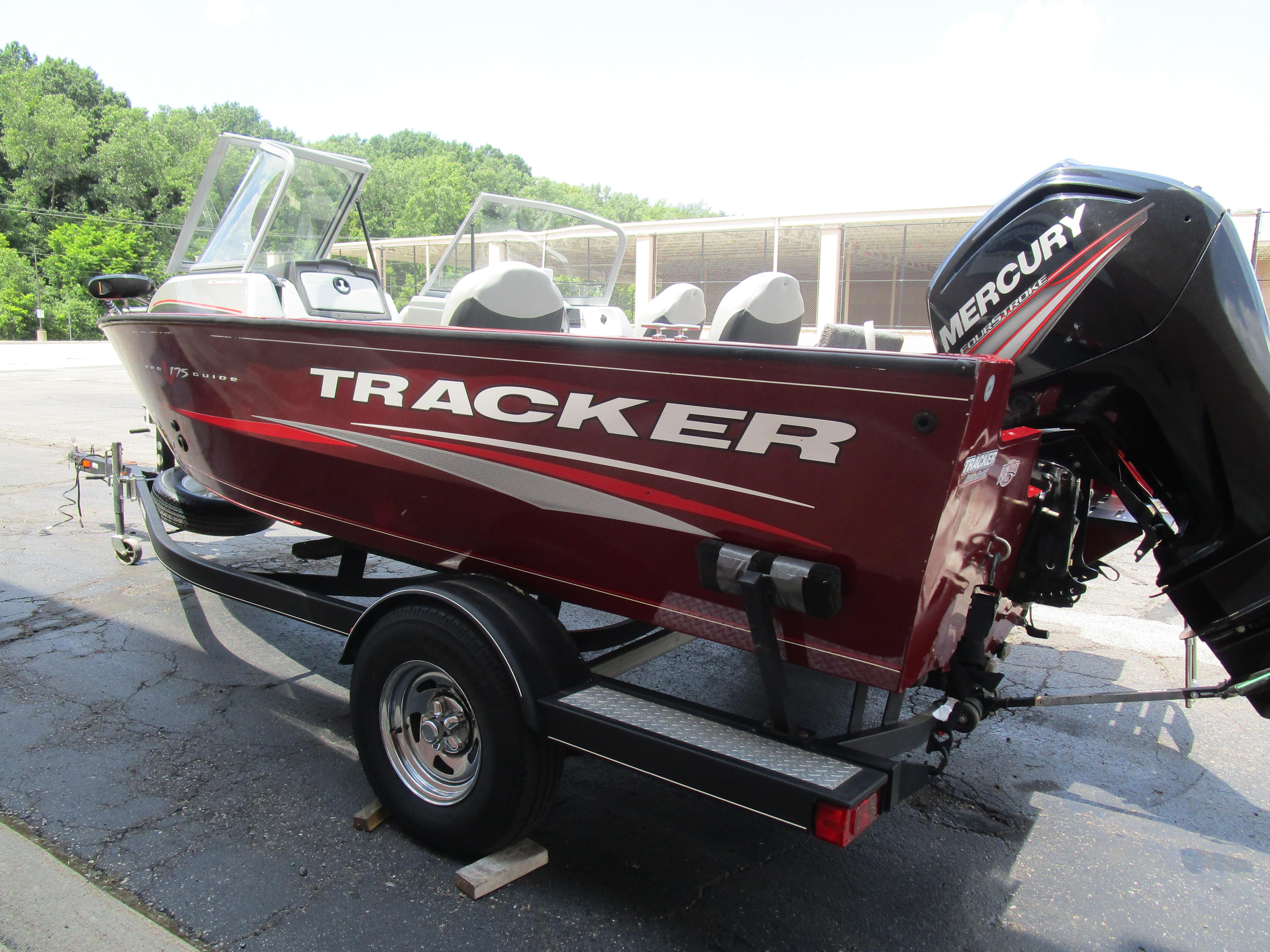 2017 Tracker PGV175 COMBO boat with Mercury engine on trailer, parked outdoors.