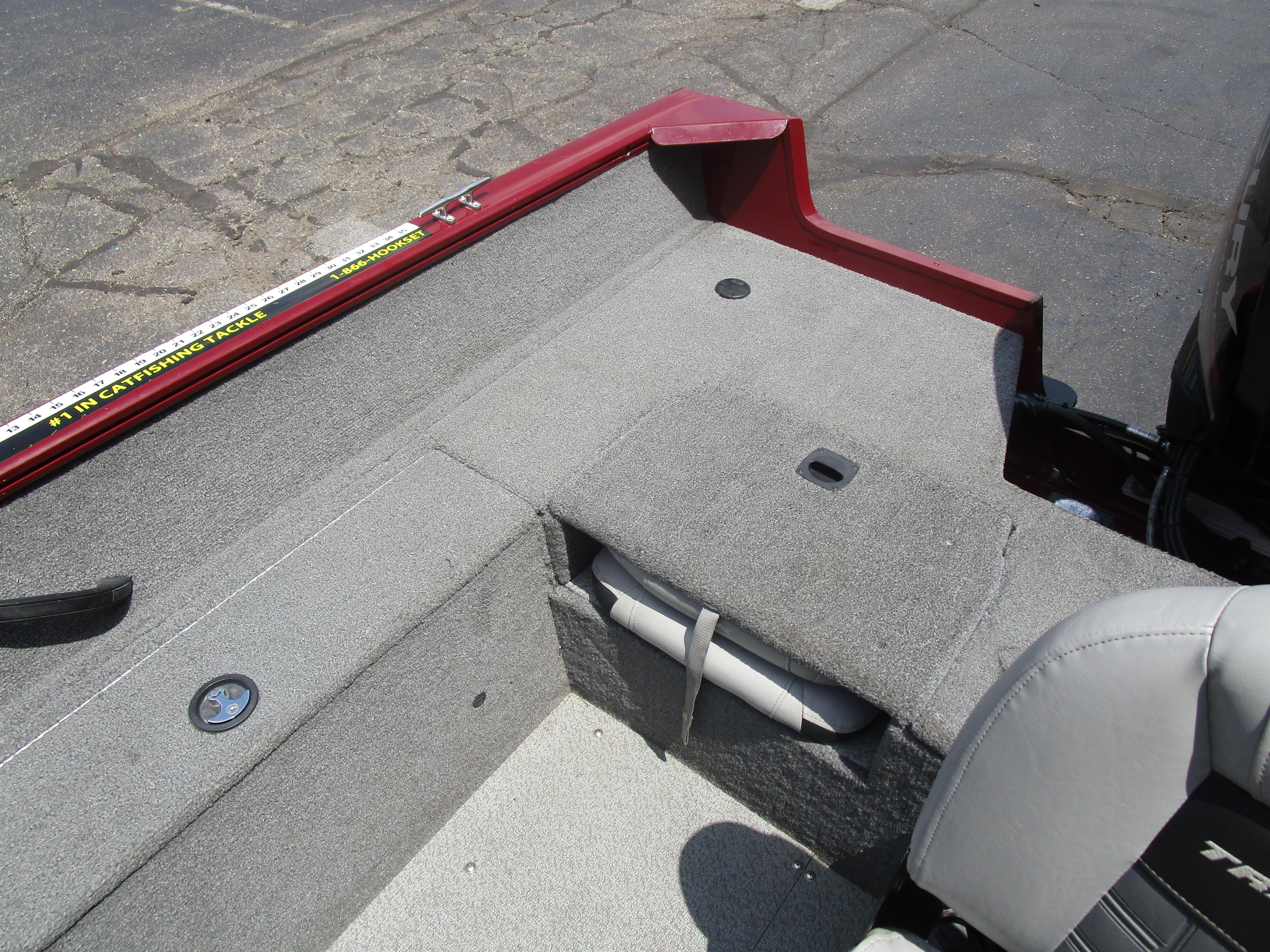 2017 Tracker PGV175 COMBO boat interior with gray carpet and seating.