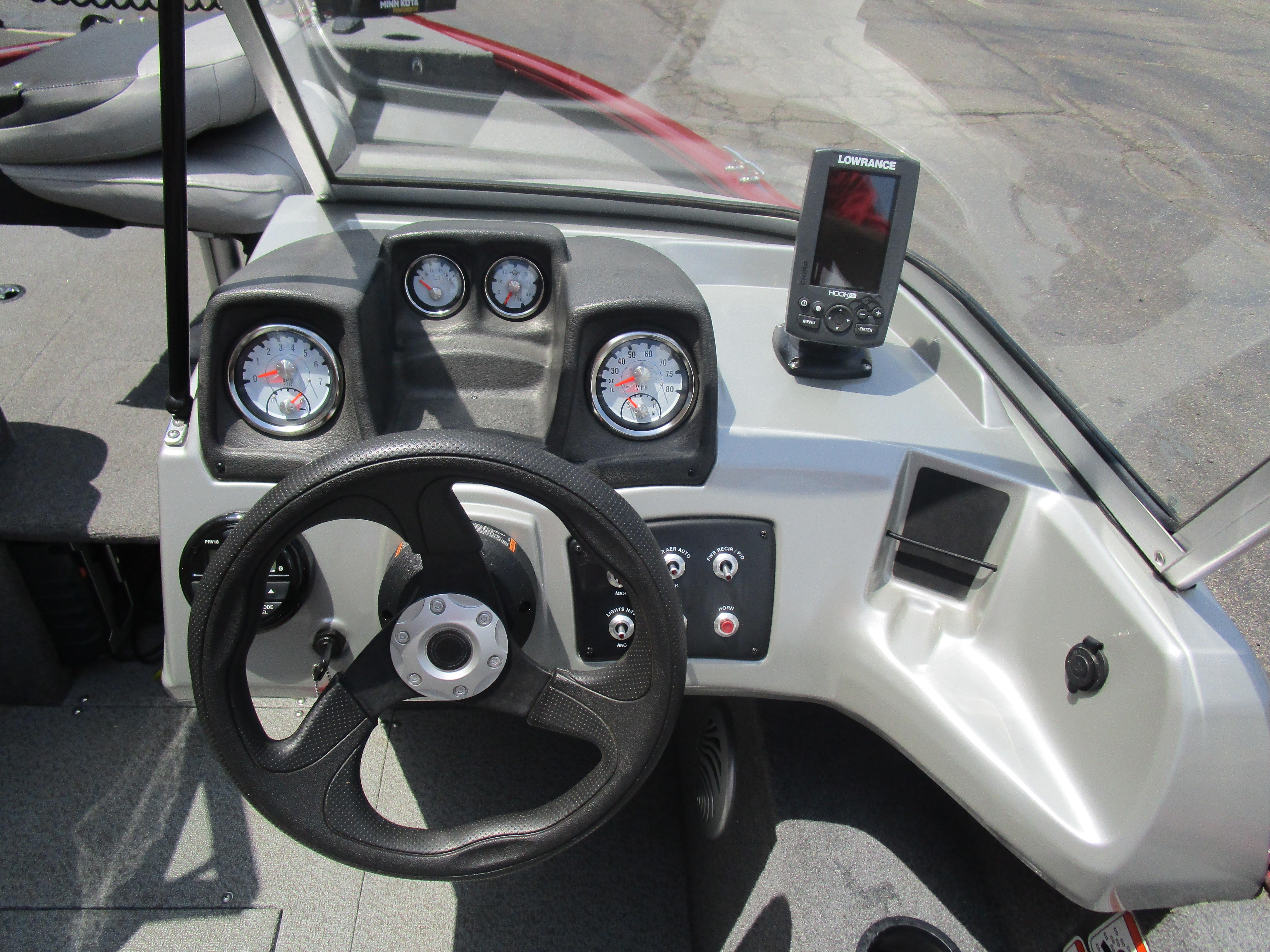 2017 Tracker PGV175 COMBO boat dashboard with steering wheel and Lowrance fish finder.