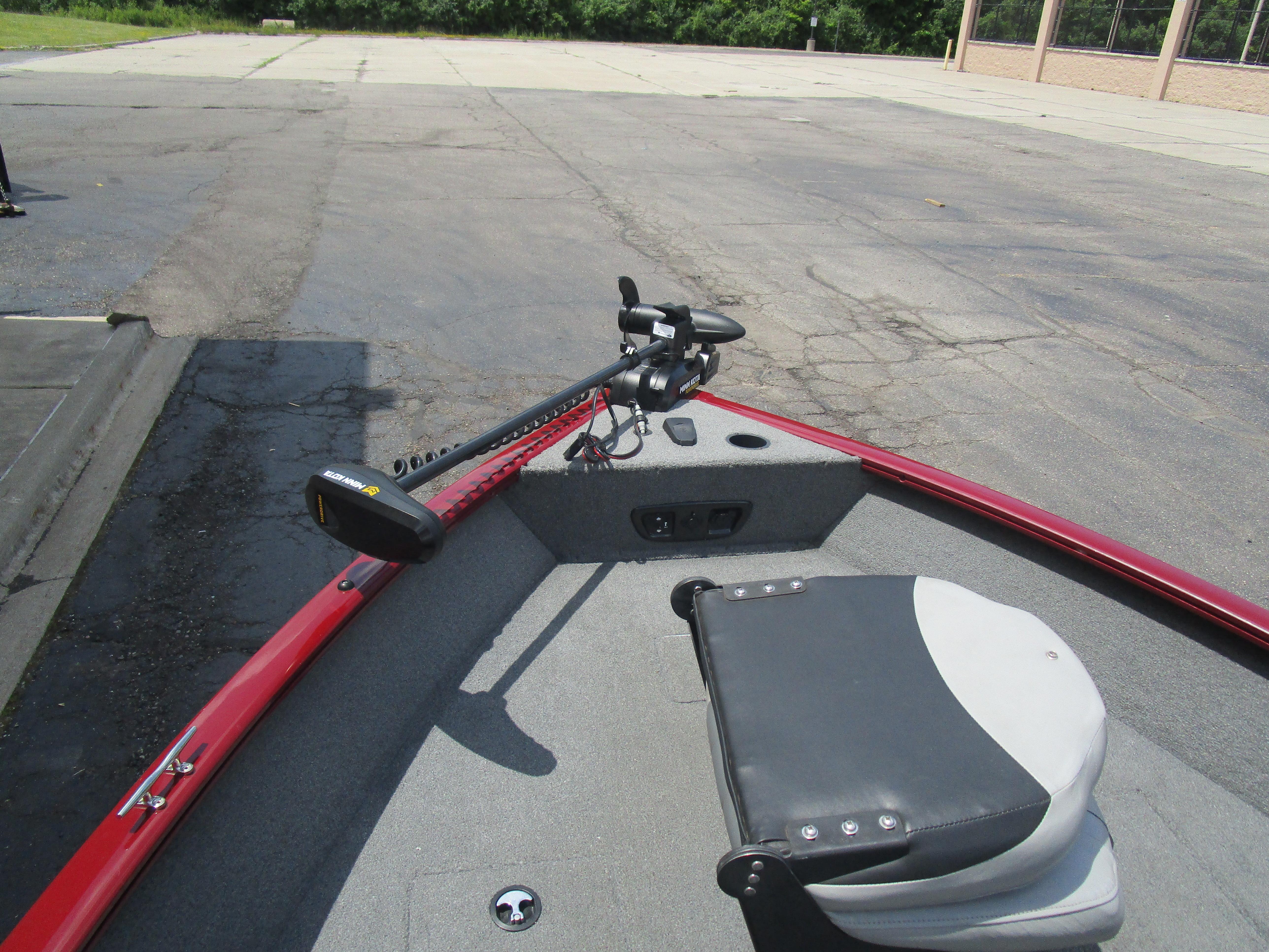 2017 Tracker PGV175 COMBO boat with trolling motor and seating, parked on pavement.
