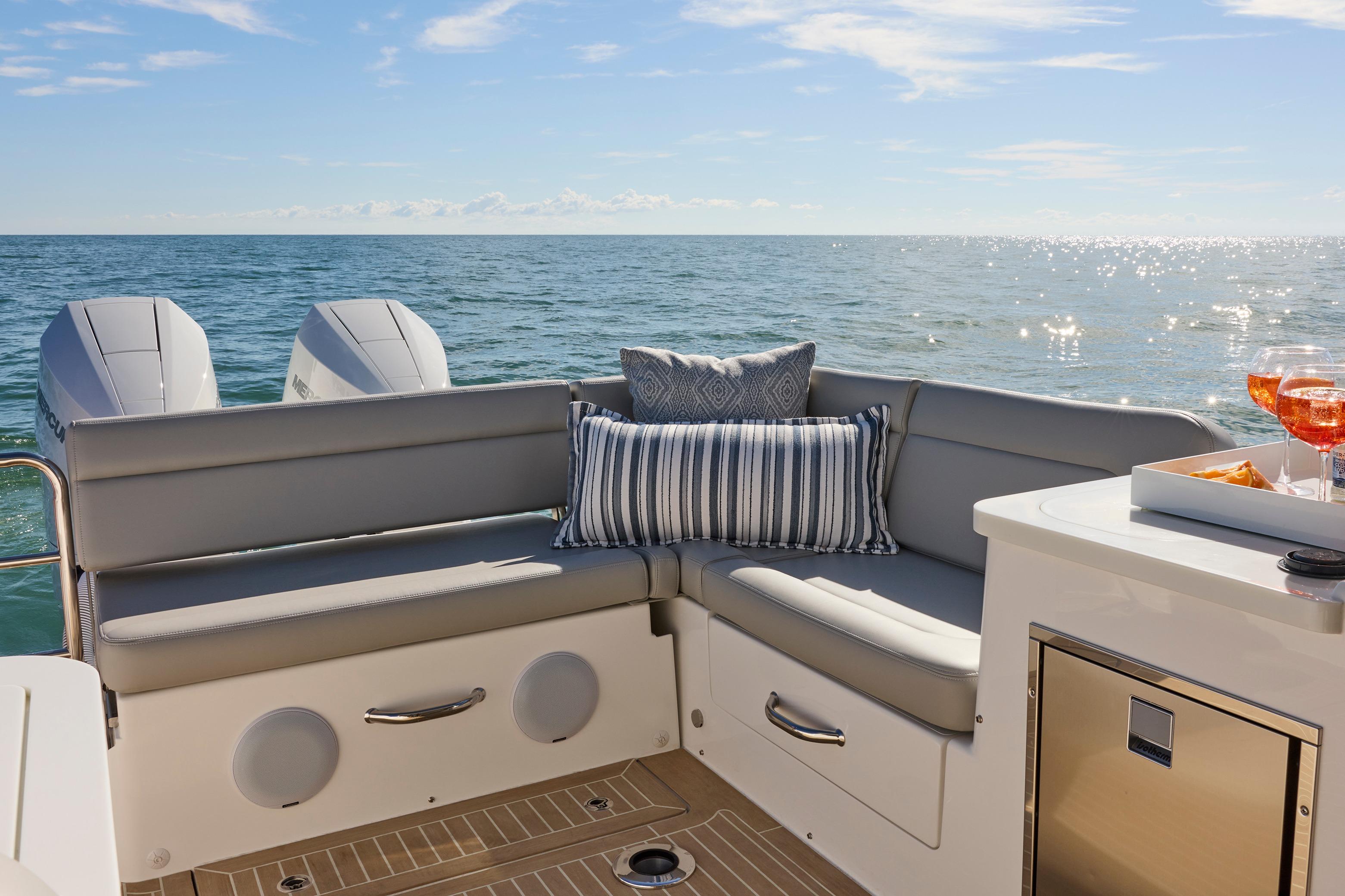 Luxurious seating on 2026 MJM 38x boat with ocean view and refreshments.