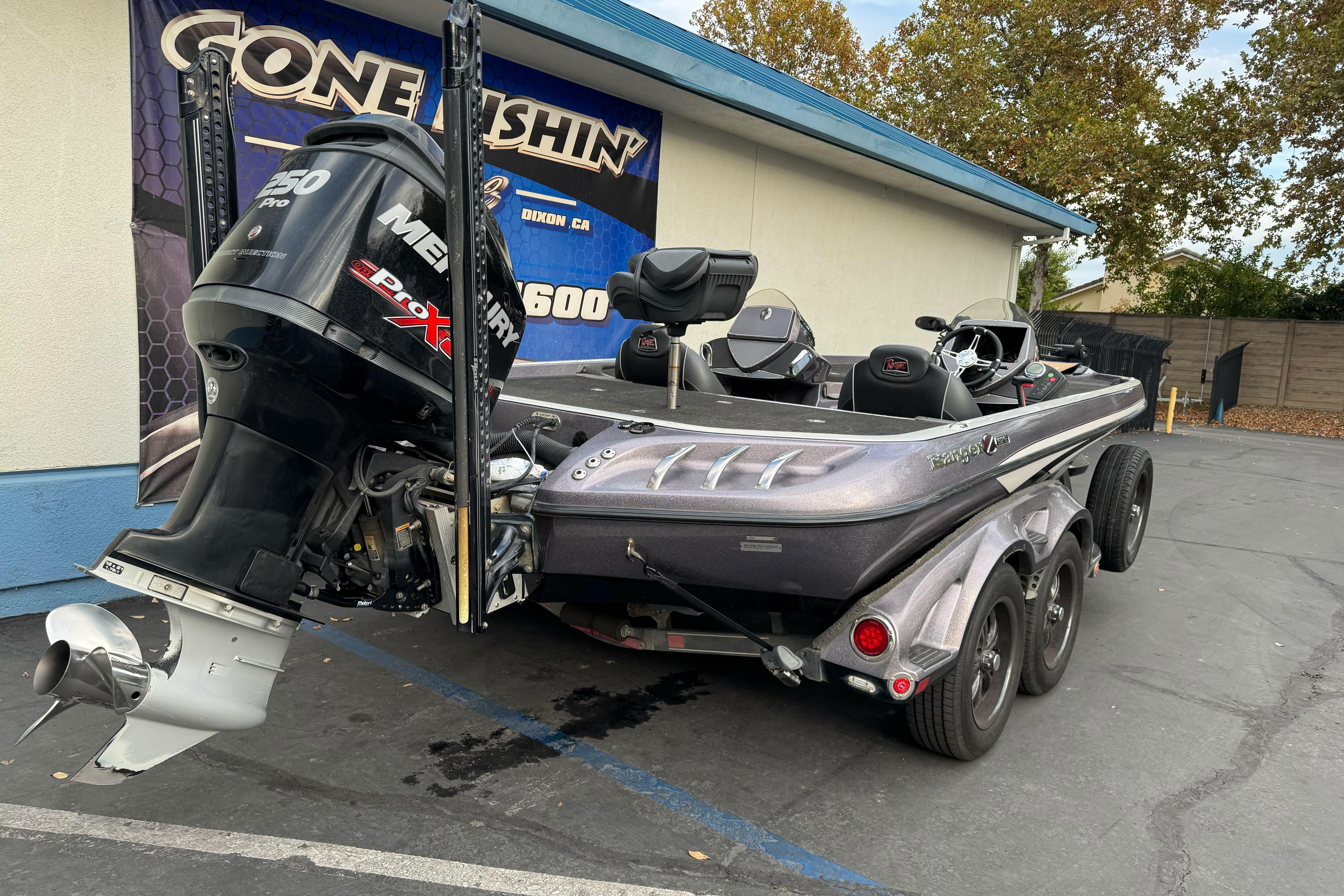 2016 Ranger Z521 Comanche boat with Mercury 250 Pro XS engine, parked outdoors.