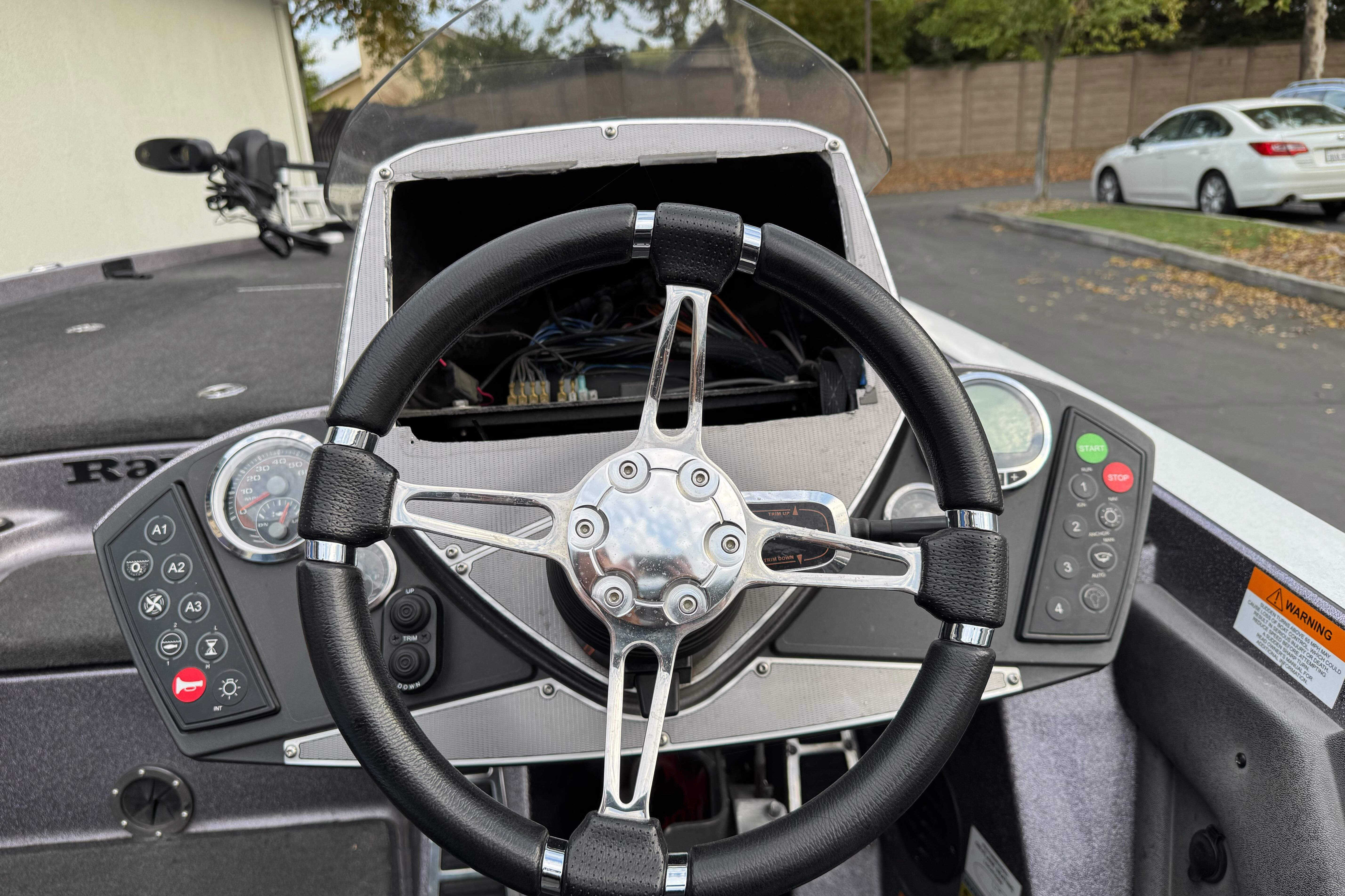 2016 Ranger Z521 Comanche boat dashboard with steering wheel and control panel.