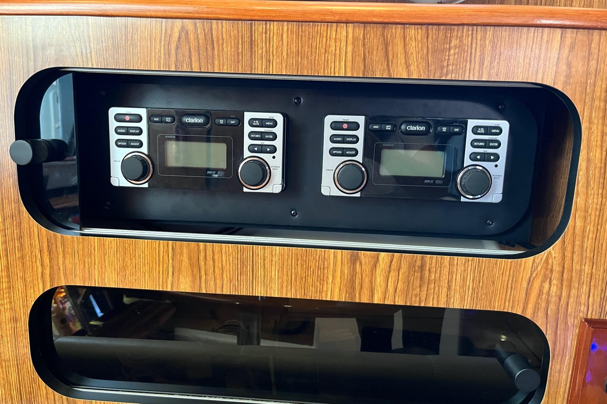 2009 Pursuit OS 375 Offshore boat stereo system with wood paneling.