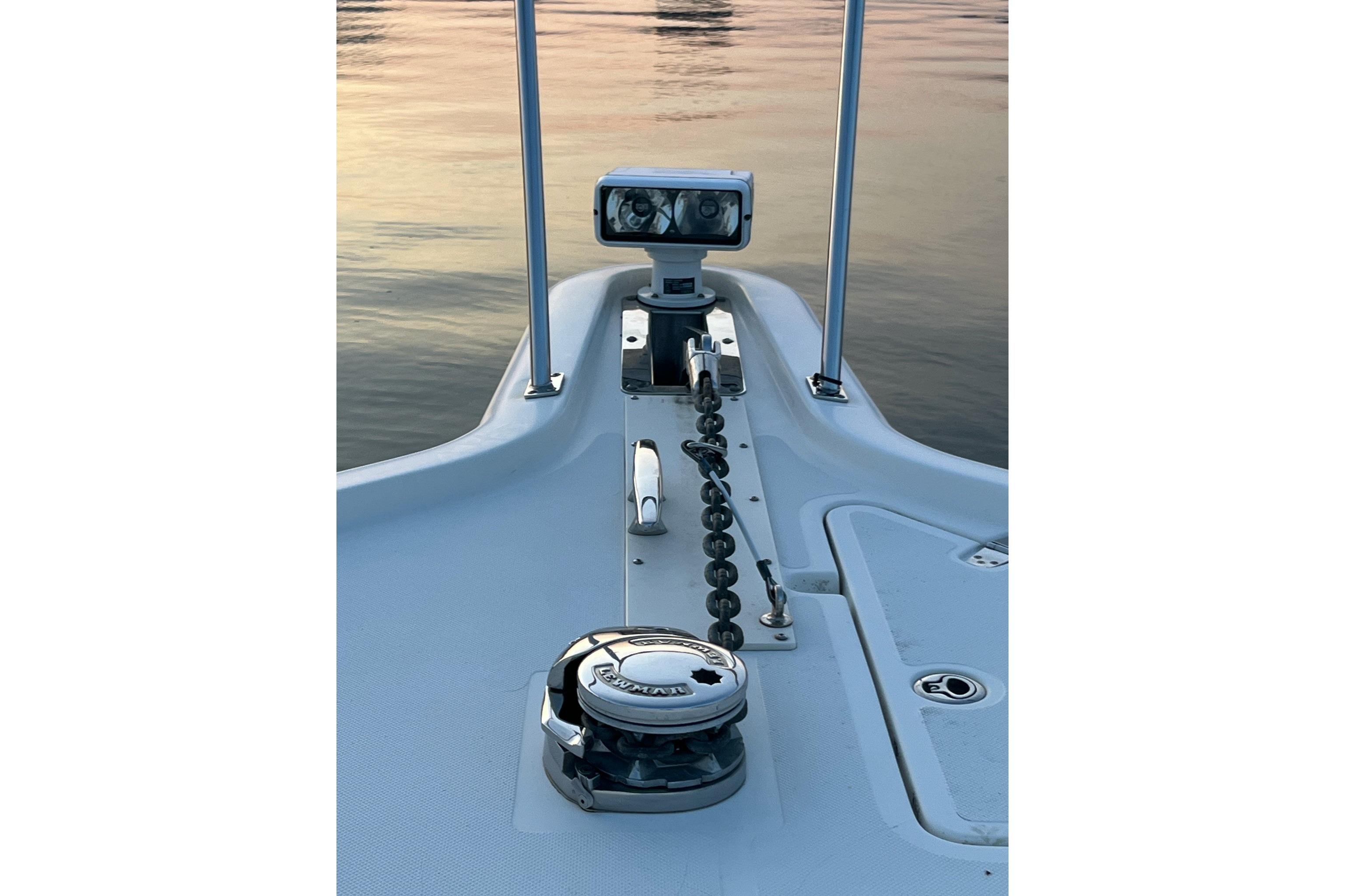 Bow of 2009 Pursuit OS 375 Offshore boat with anchor chain and winch.
