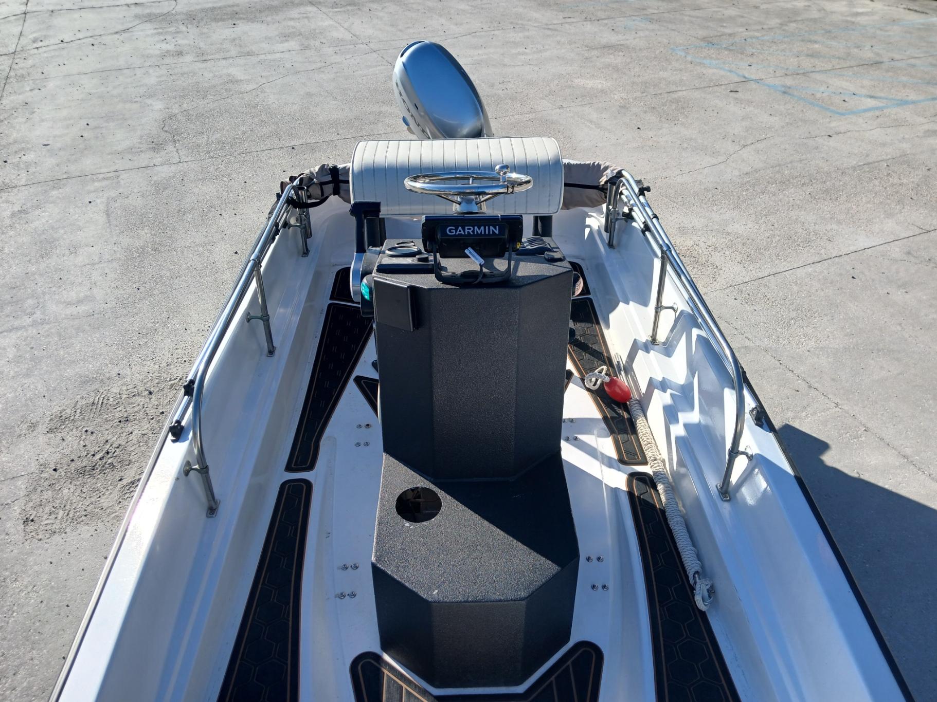 1980 Boston Whaler 15 Montauk boat interior with Garmin equipment, viewed from above.