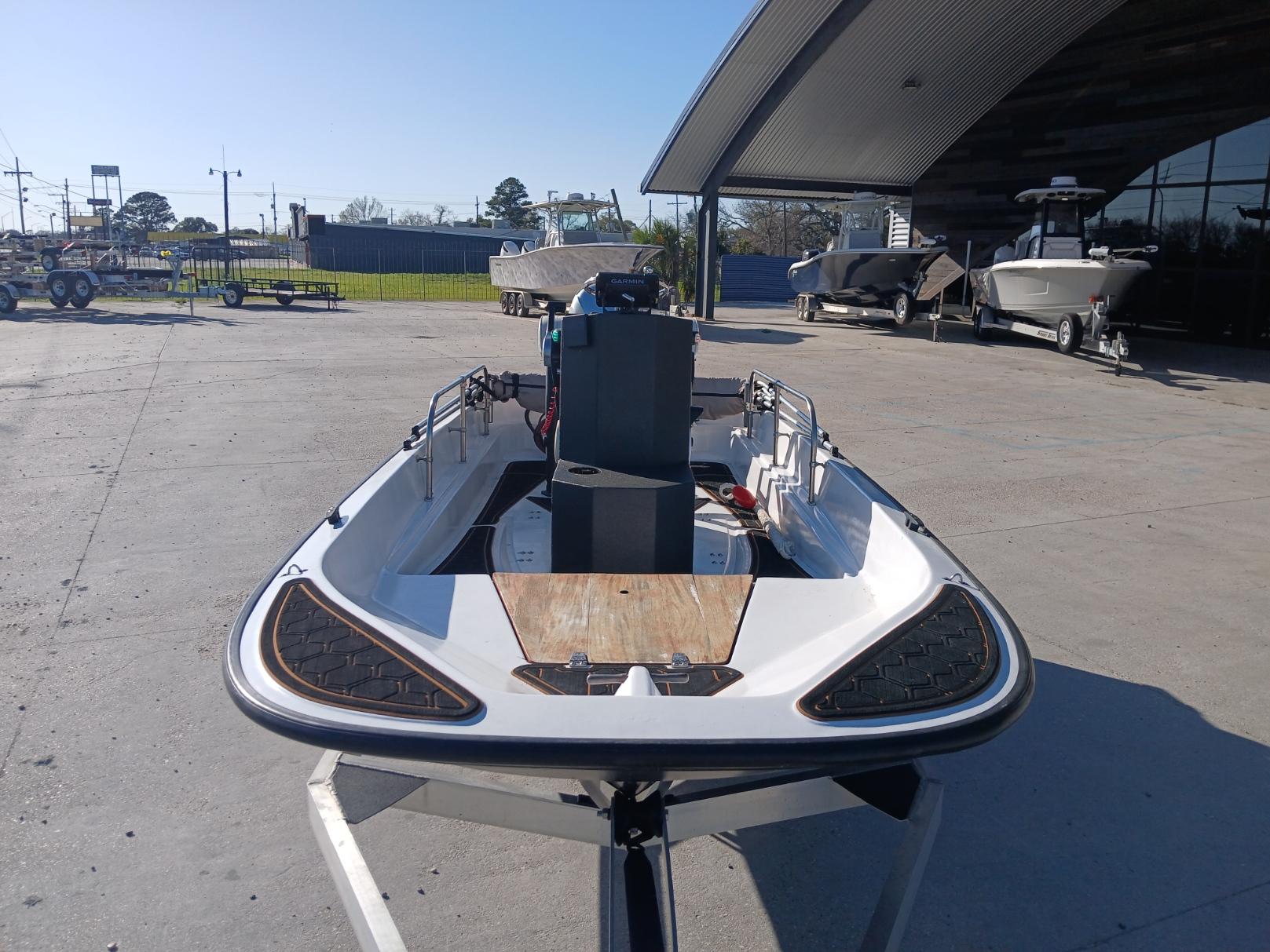1980 Boston Whaler 15 Montauk boat on trailer in outdoor storage area.