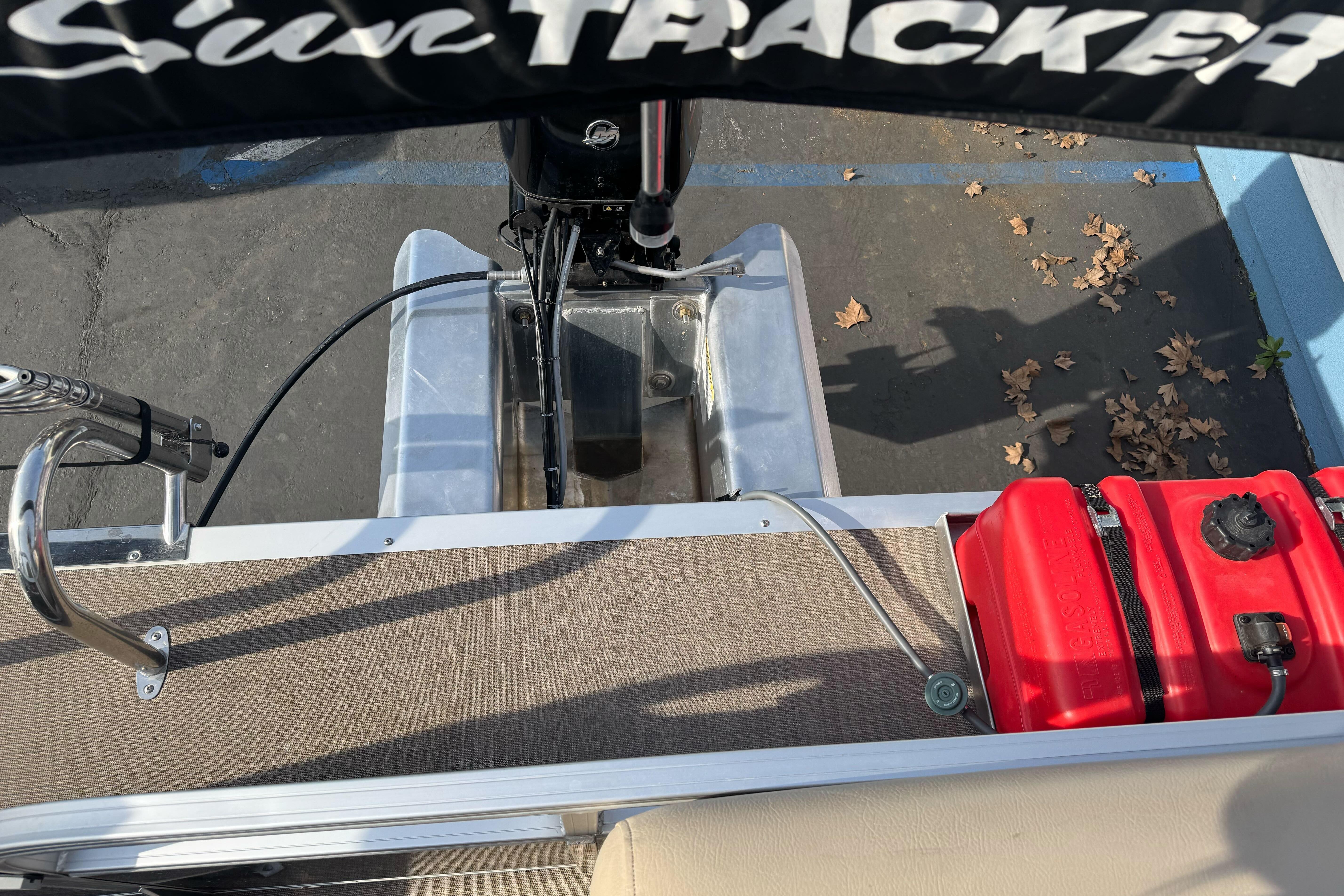 2024 Sun Tracker Party Barge 16 DLX rear view with motor and fuel tank.