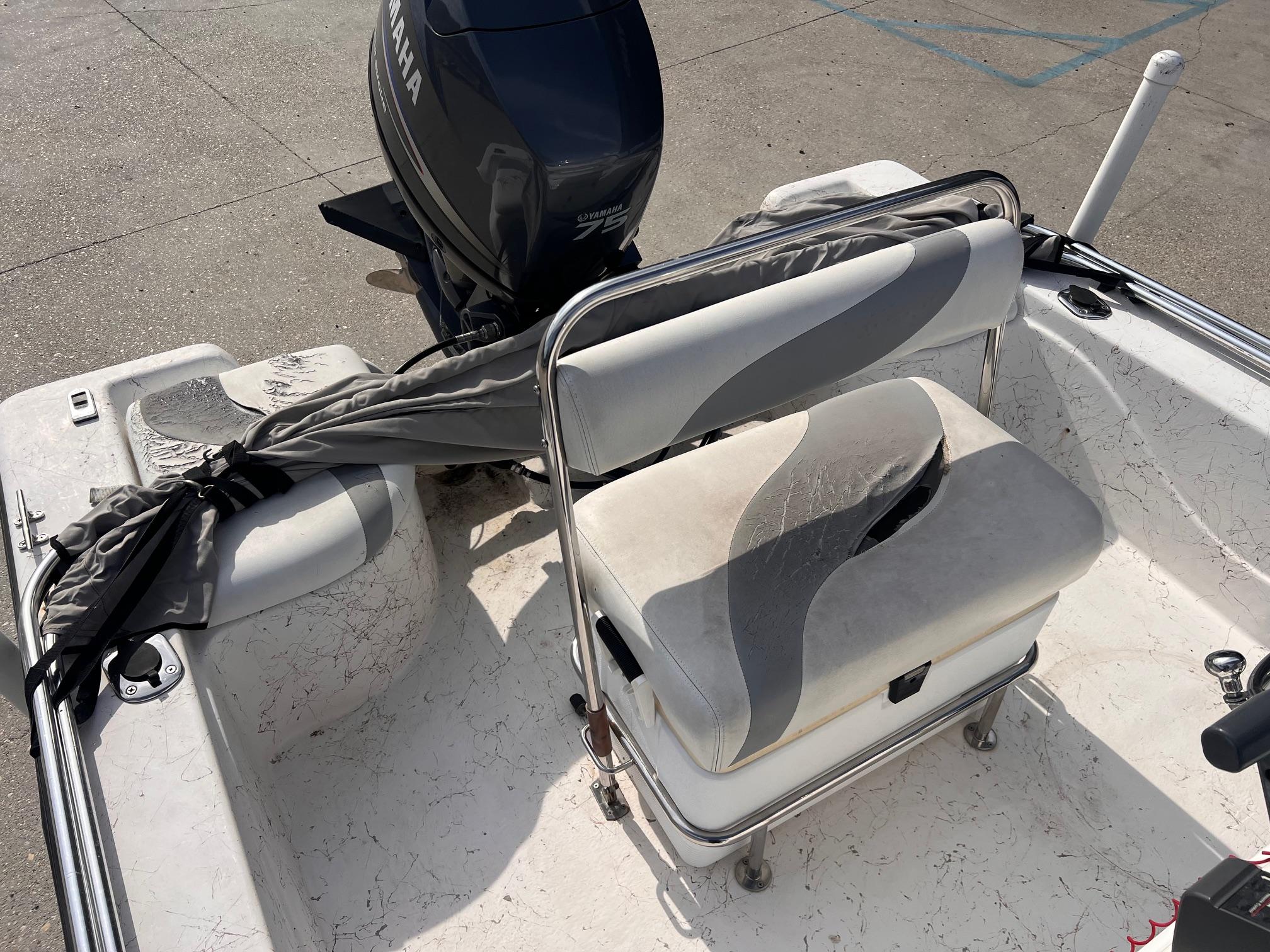 2010 Blue Wave 160 V Bay boat interior with Yamaha motor and seating.