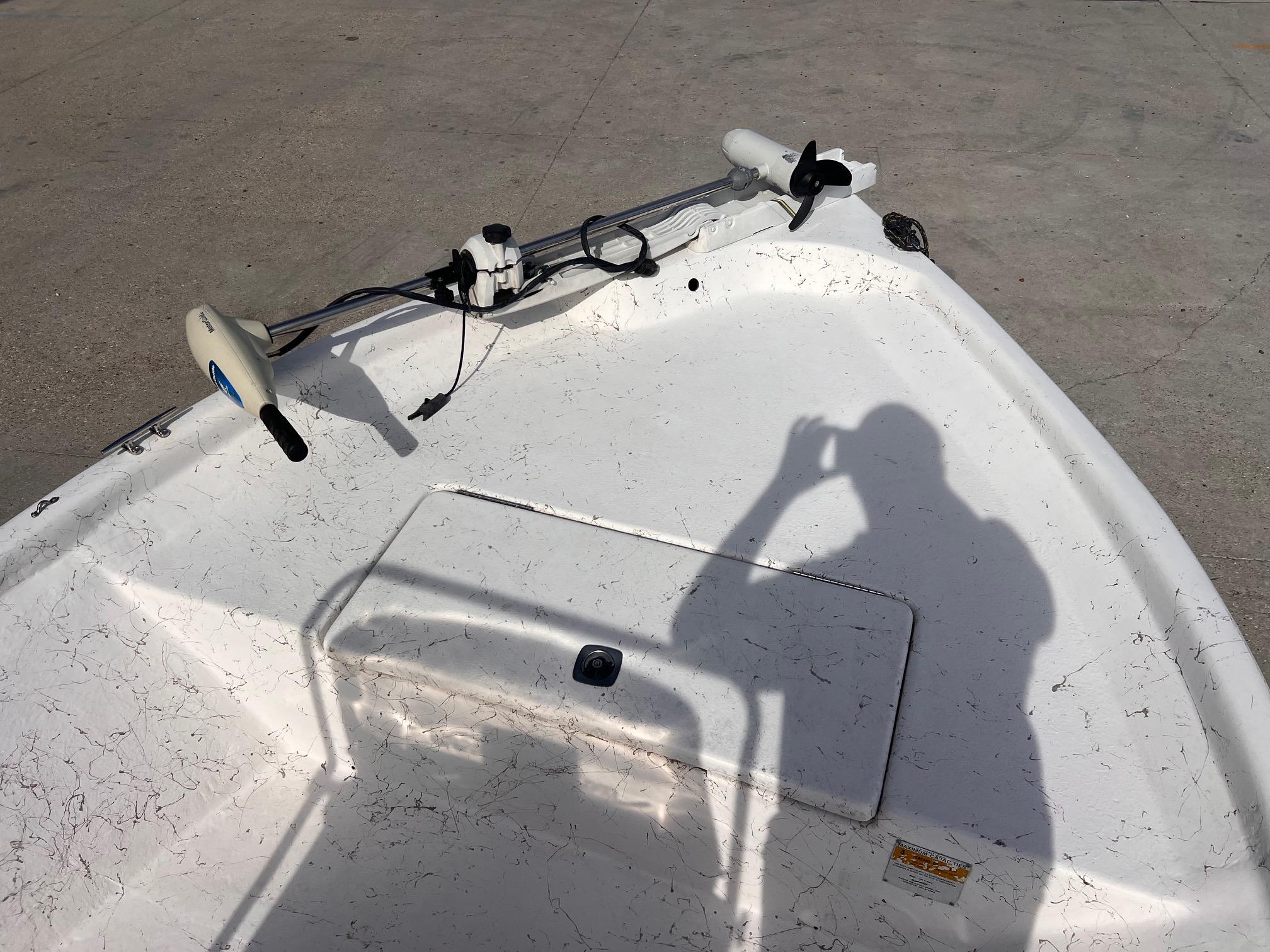 2010 Blue Wave 160 V Bay boat deck with trolling motor and shadow.