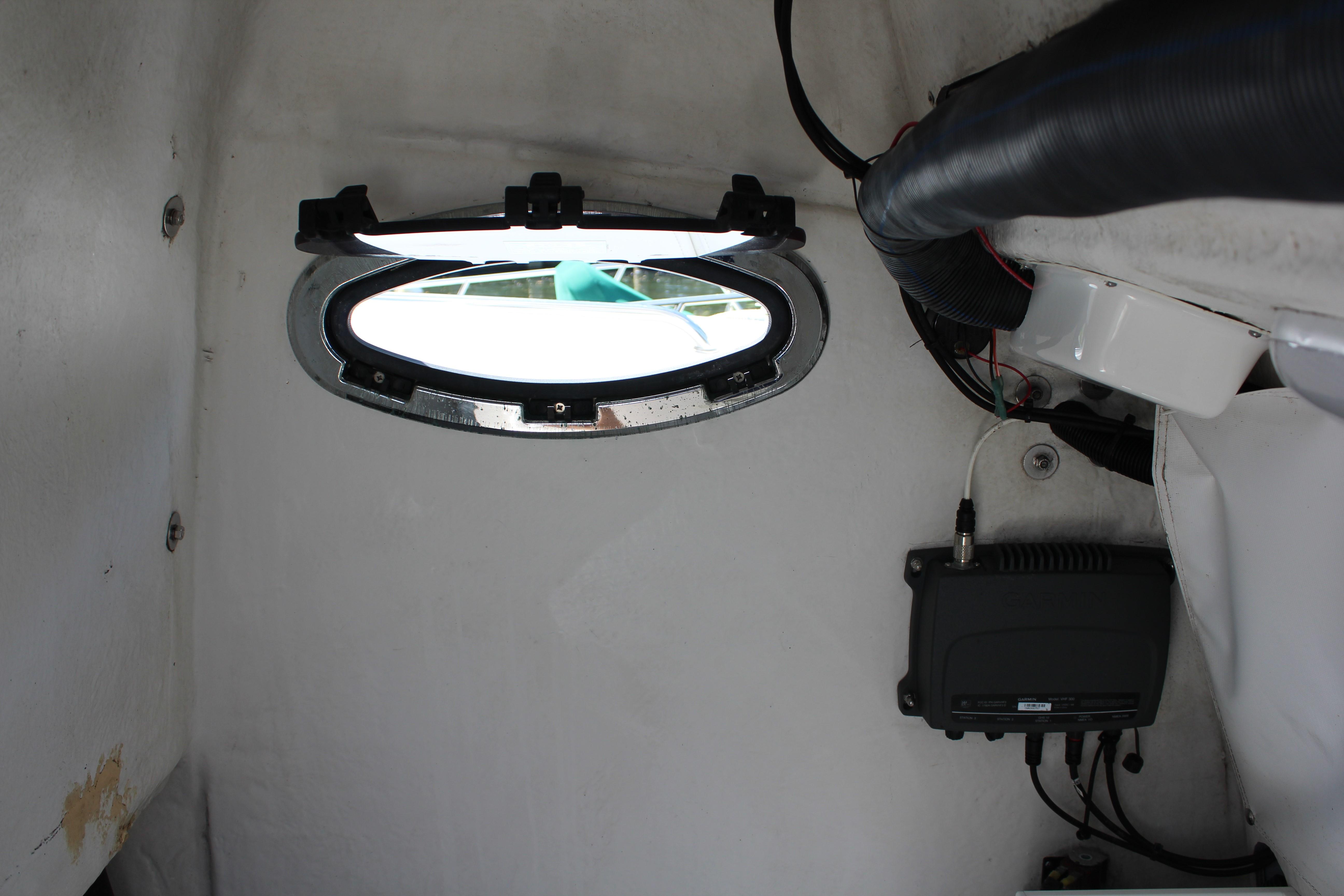 Head compartment with opening portlight