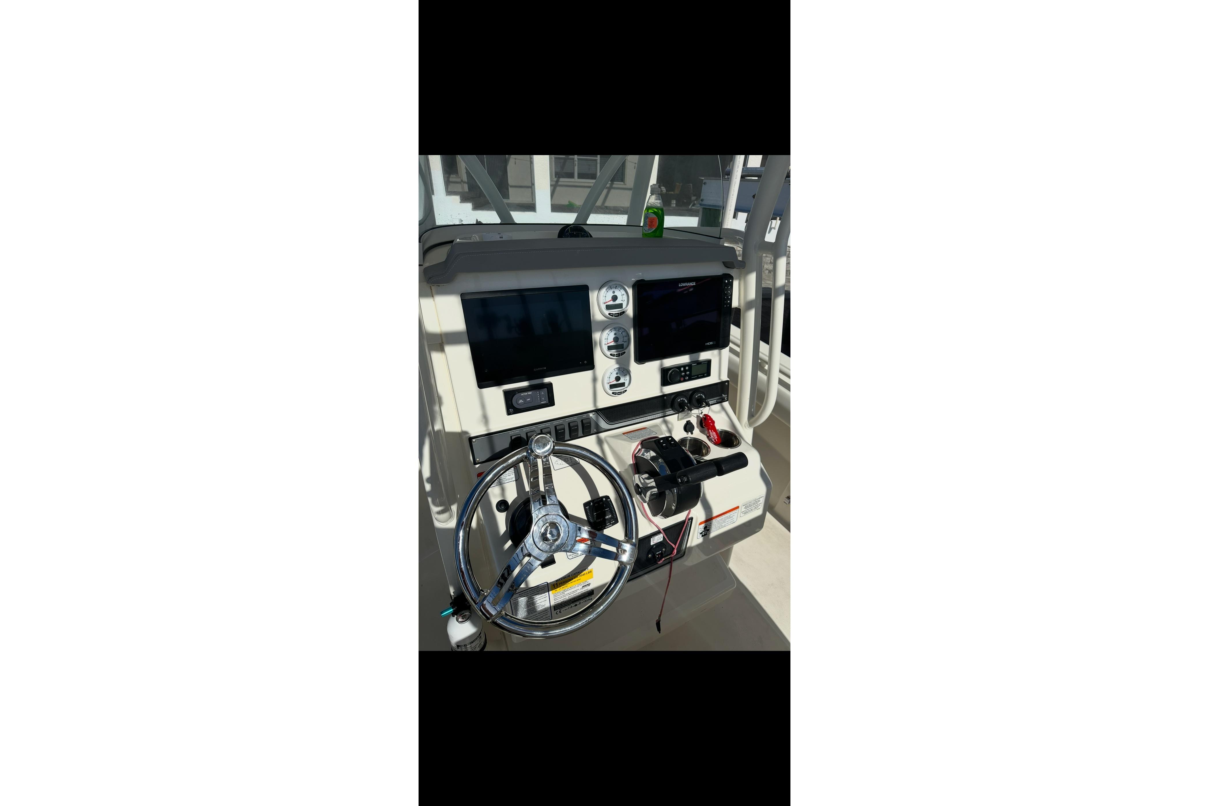 Steering console of 2020 Mako 235 boat with modern controls and displays.