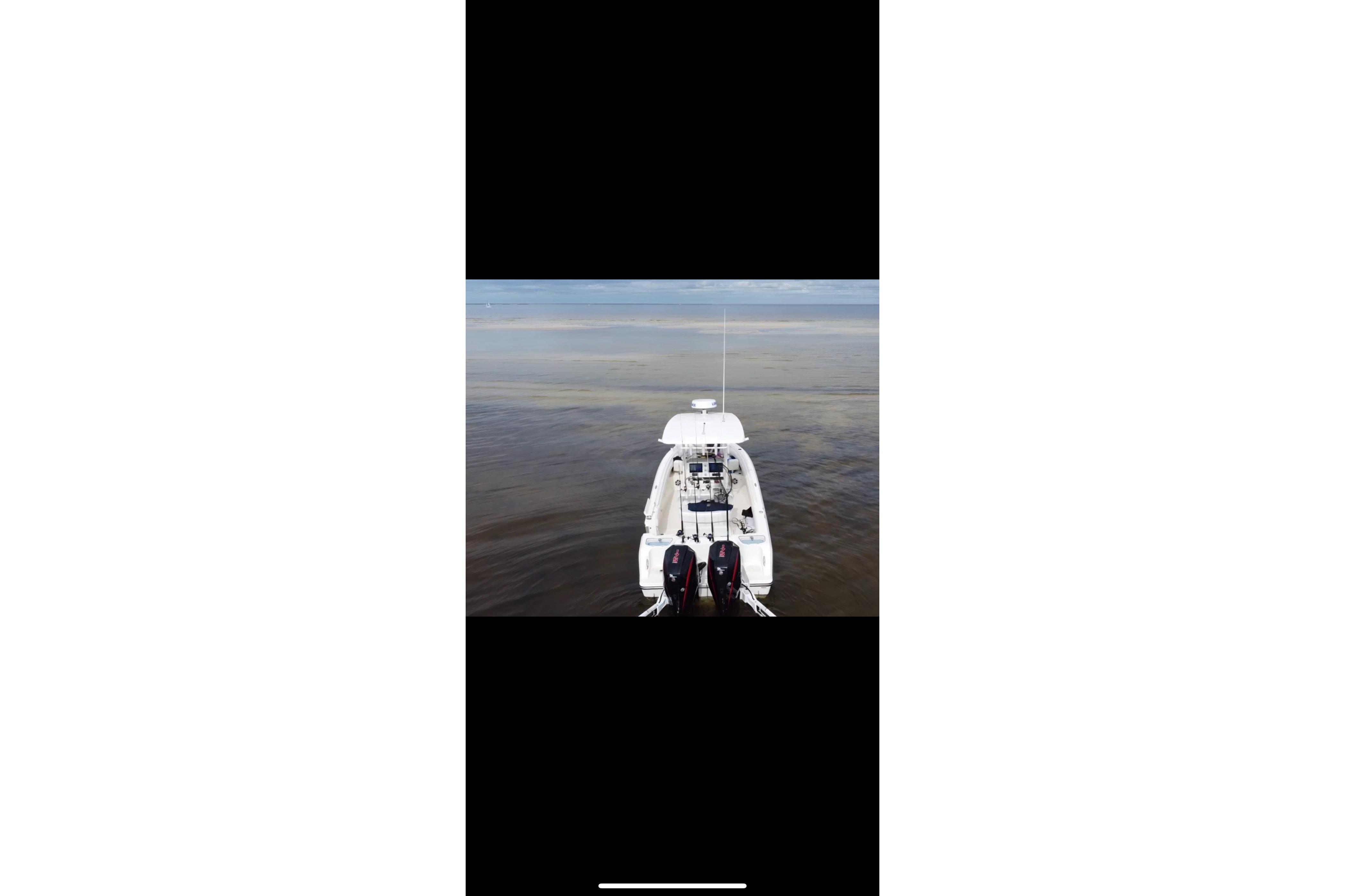 2020 Mako 235 boat on calm water, aerial view.