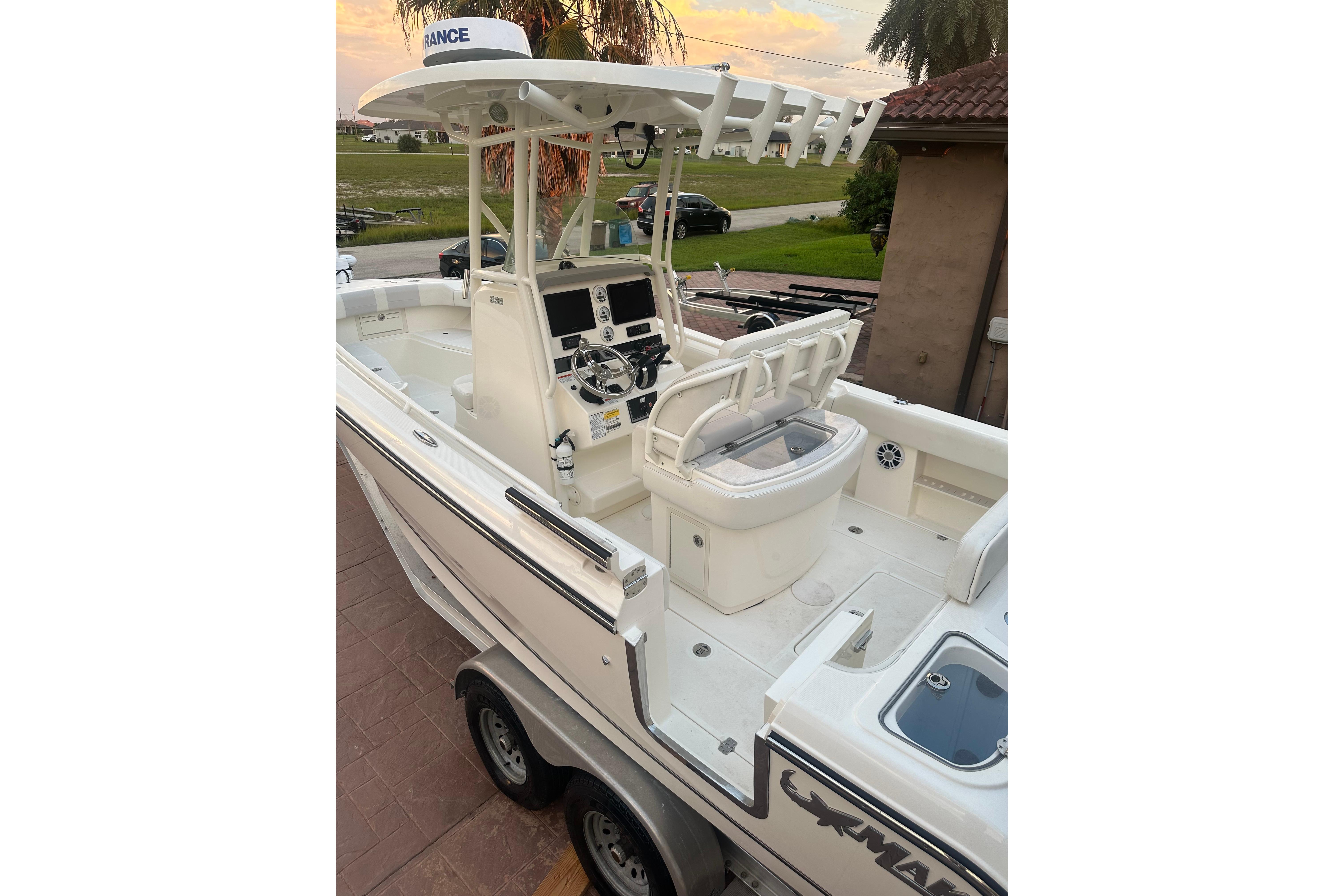 2020 Mako 235 boat with dual console and modern navigation equipment.