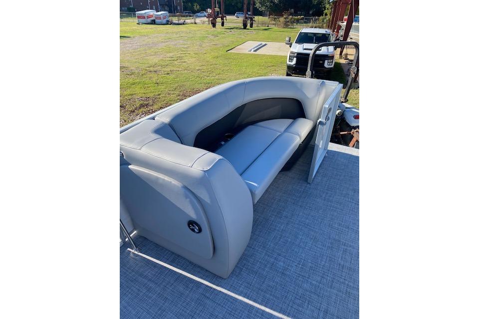 2026 Sun Tracker Party Barge 18 DLX with gray seating on deck.