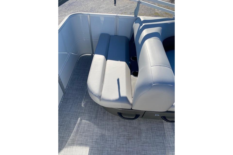 2026 Sun Tracker Party Barge 18 DLX interior seating with gray upholstery.