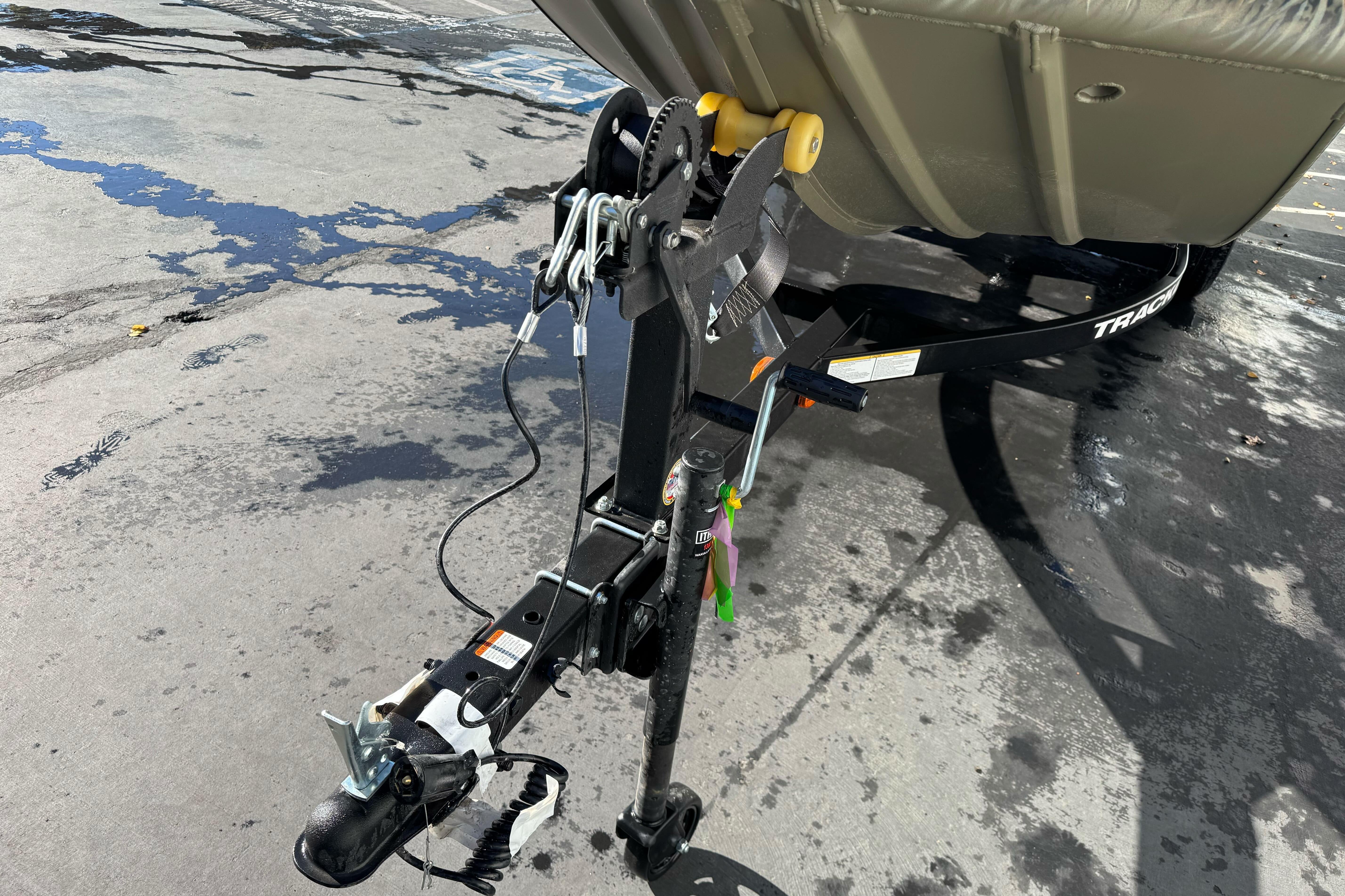 Trailer hitch of 2026 Tracker Grizzly 1650 T Prairie Wings Edition on wet pavement.