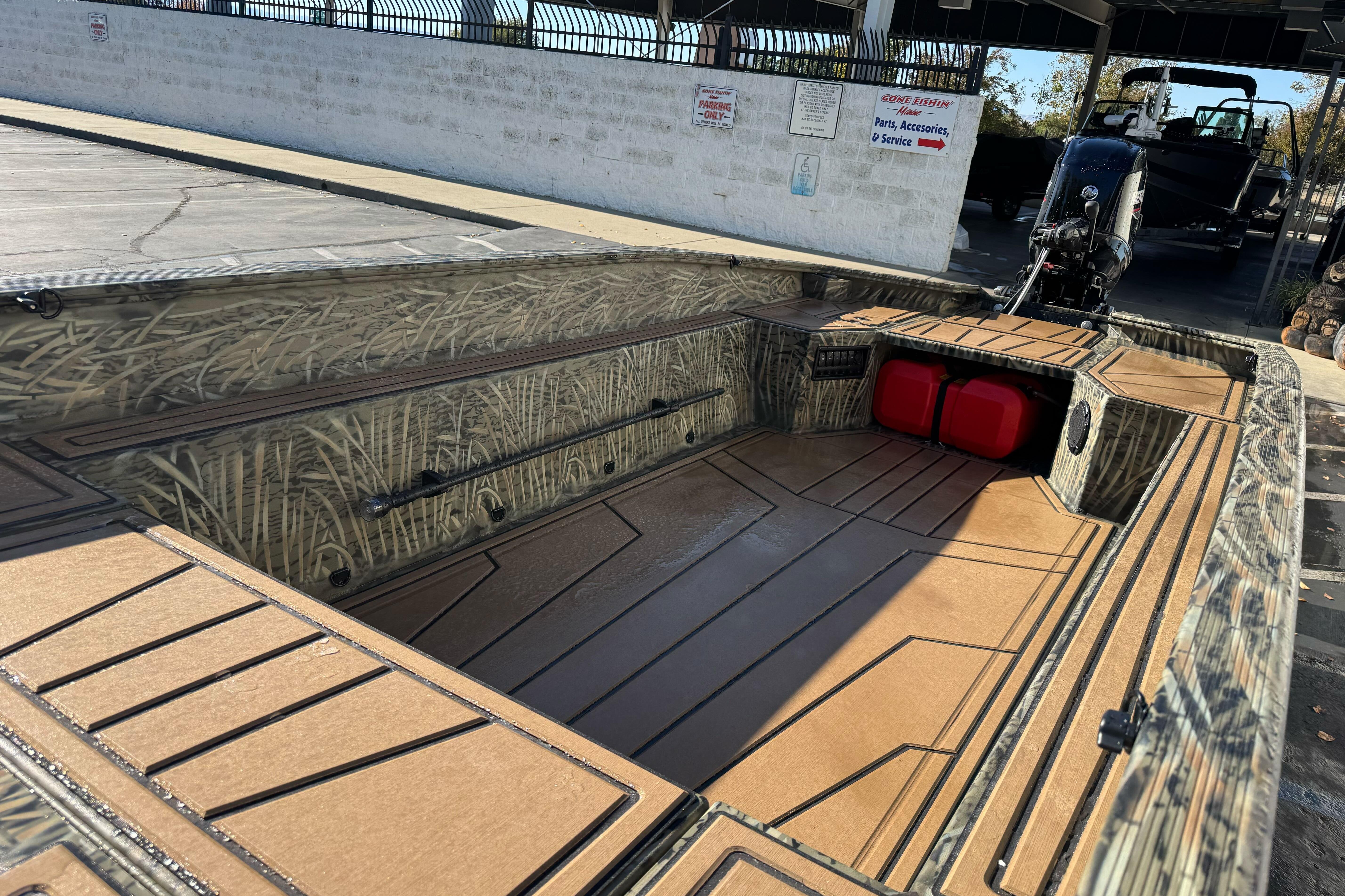2026 Tracker Grizzly 1650 T Prairie Wings Edition boat interior with camouflage design.