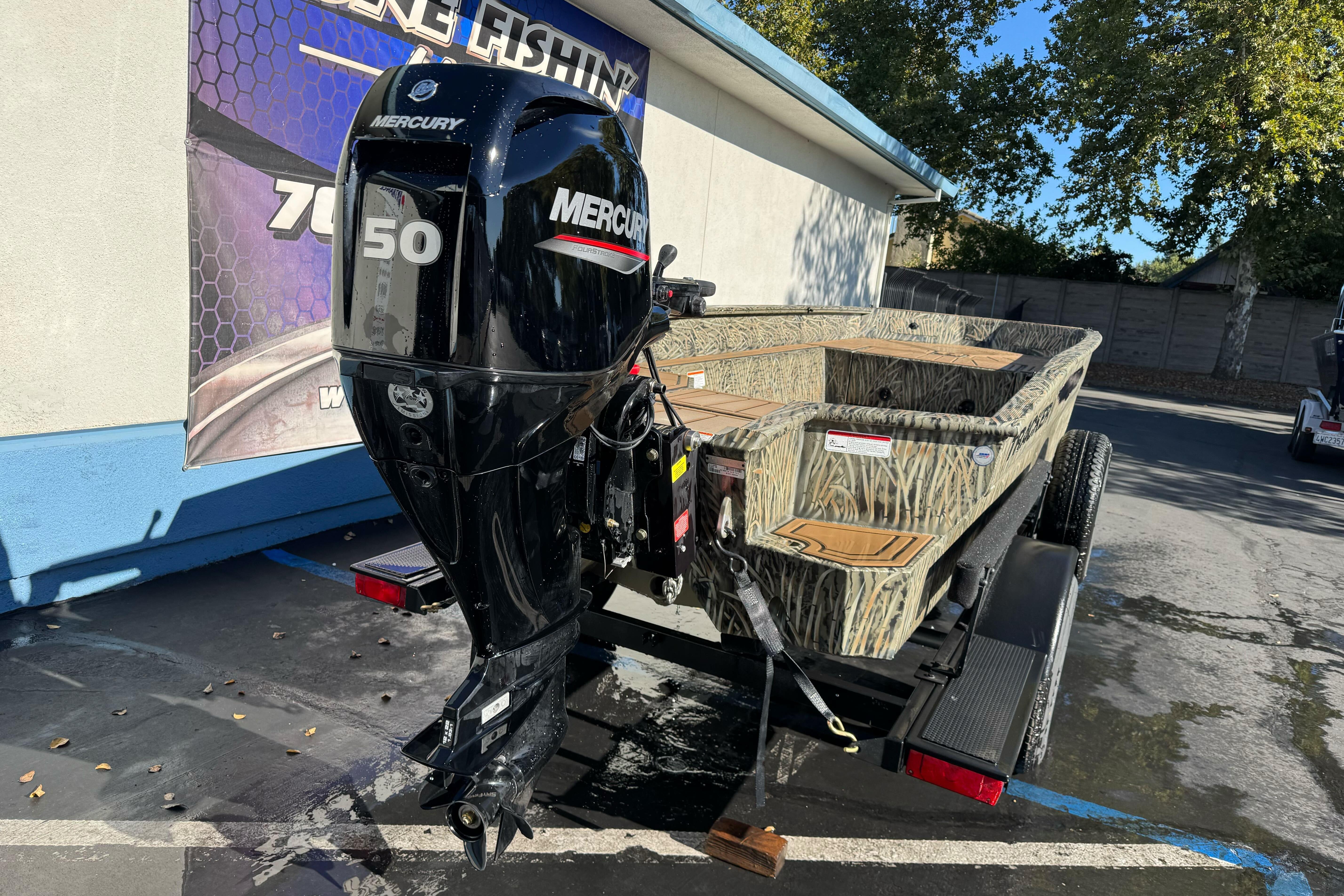 2026 Tracker Grizzly 1650 T Prairie Wings Edition boat with Mercury 50 engine.