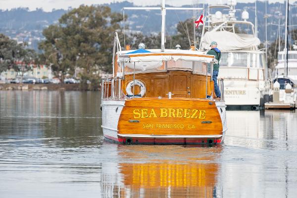 1939 Stephens Brothers Bridgedeck Cruiser "Sea Breeze" on calm water in San Francisco.