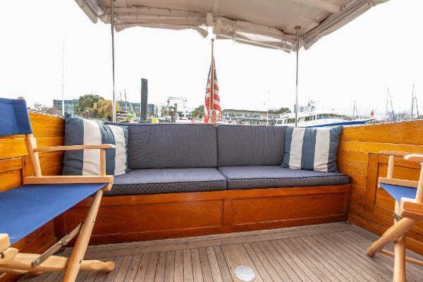 1939 Stephens Brothers Bridgedeck Cruiser interior with wooden seating and nautical decor.