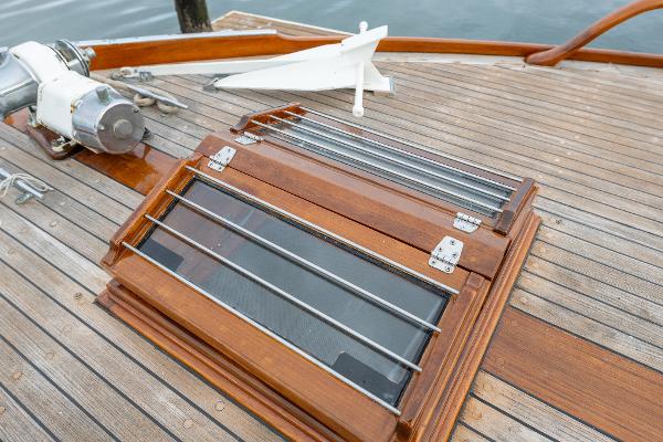 1939 Stephens Brothers Bridgedeck Cruiser deck with wooden hatch and anchor.