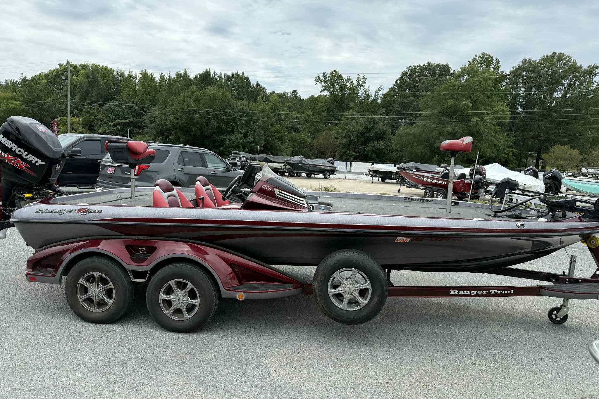 2014 Ranger Z521 Comanche bass boat on trailer, parked outdoors.