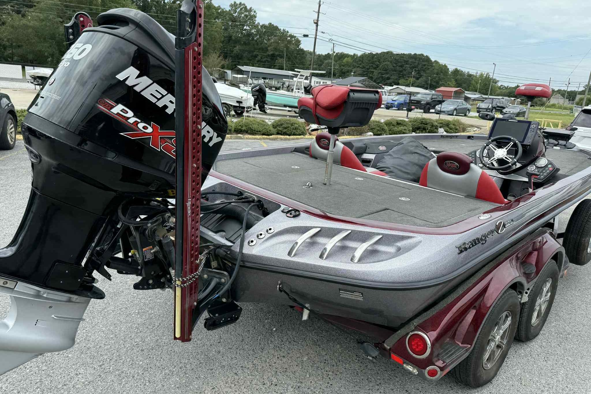2014 Ranger Z521 Comanche boat with Mercury Pro XS engine, parked on a trailer.
