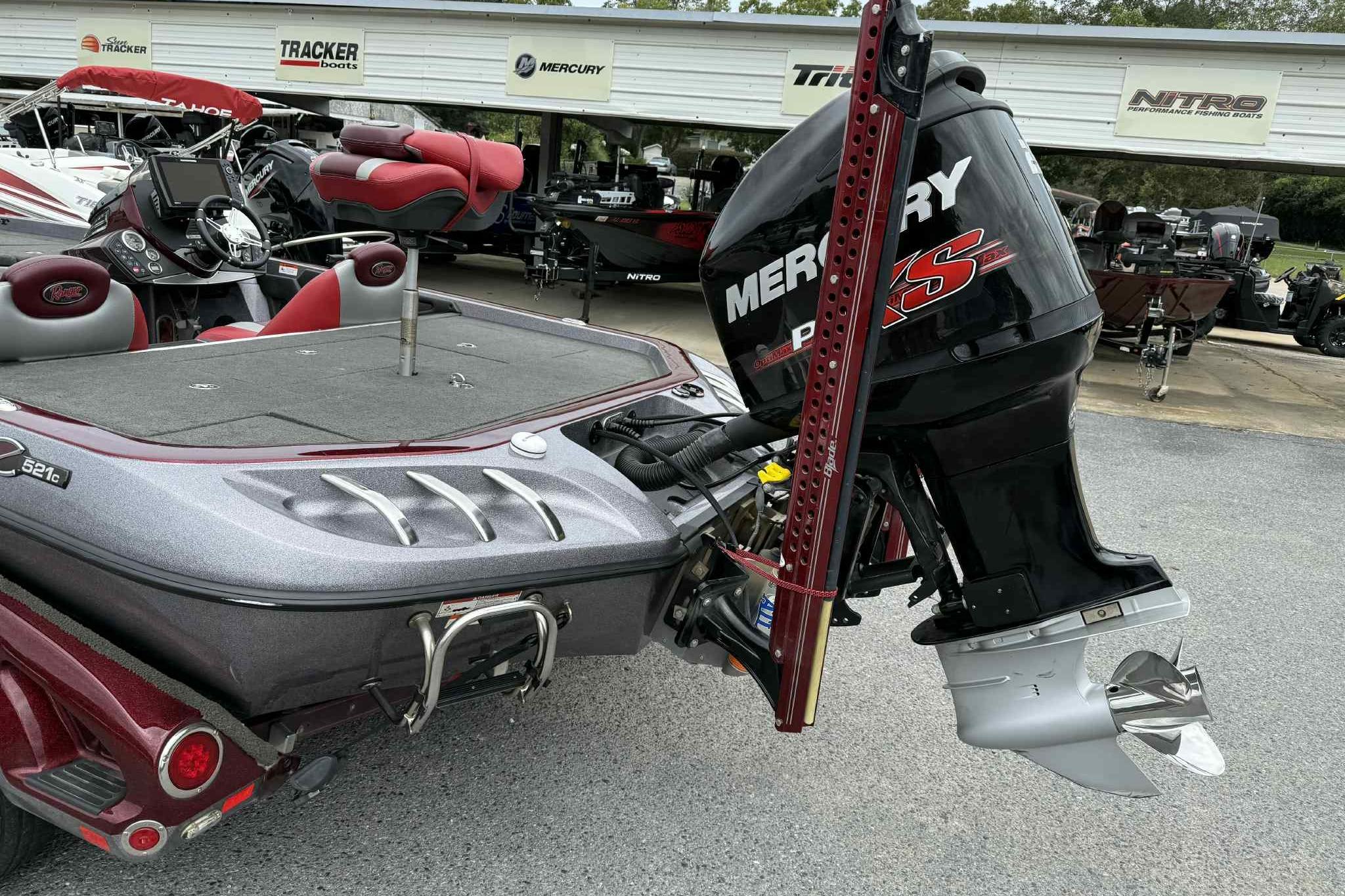 2014 Ranger Z521 Comanche boat with Mercury Pro XS engine, parked at dealership.