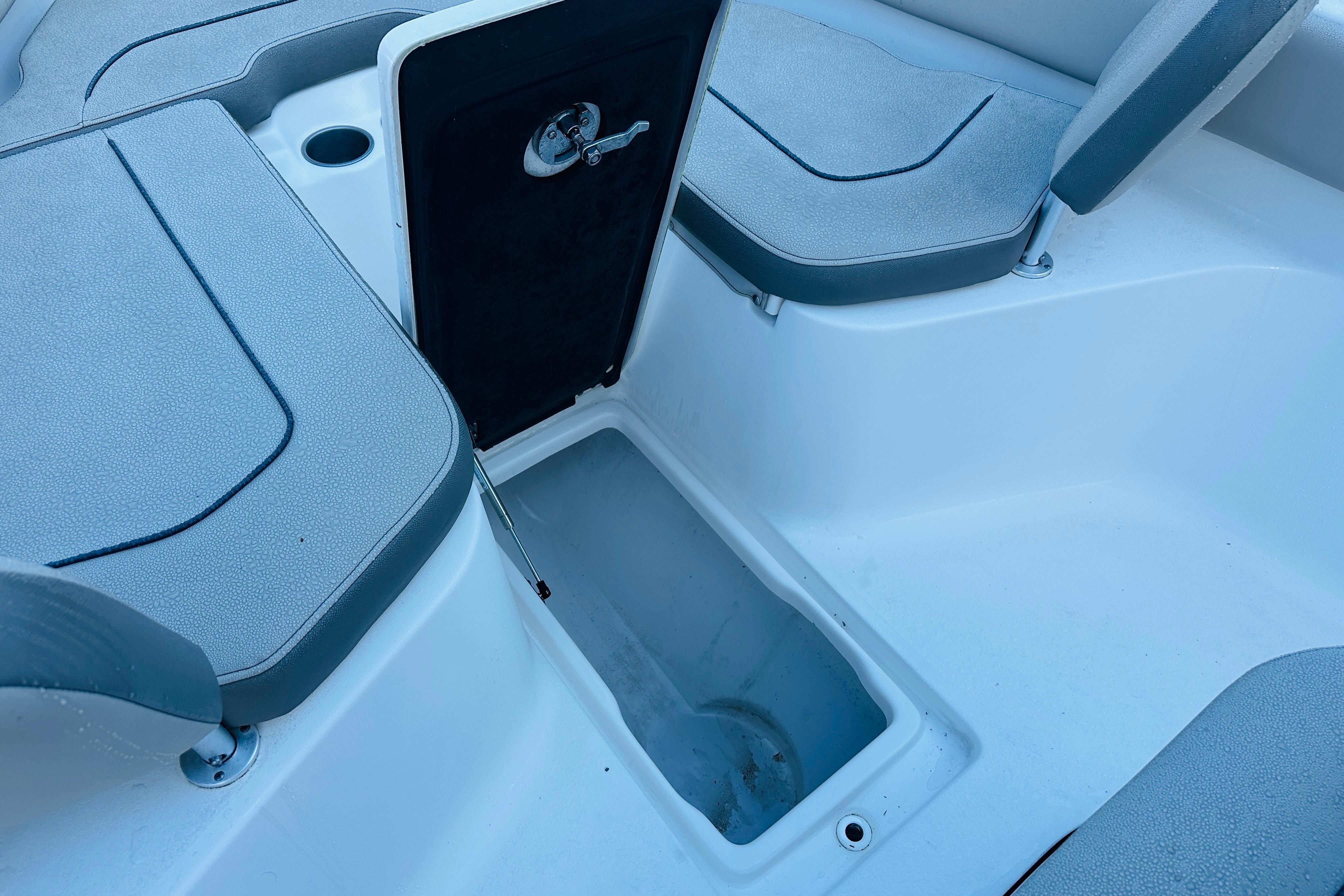 2022 Key West 239 FS boat interior storage compartment with seating.