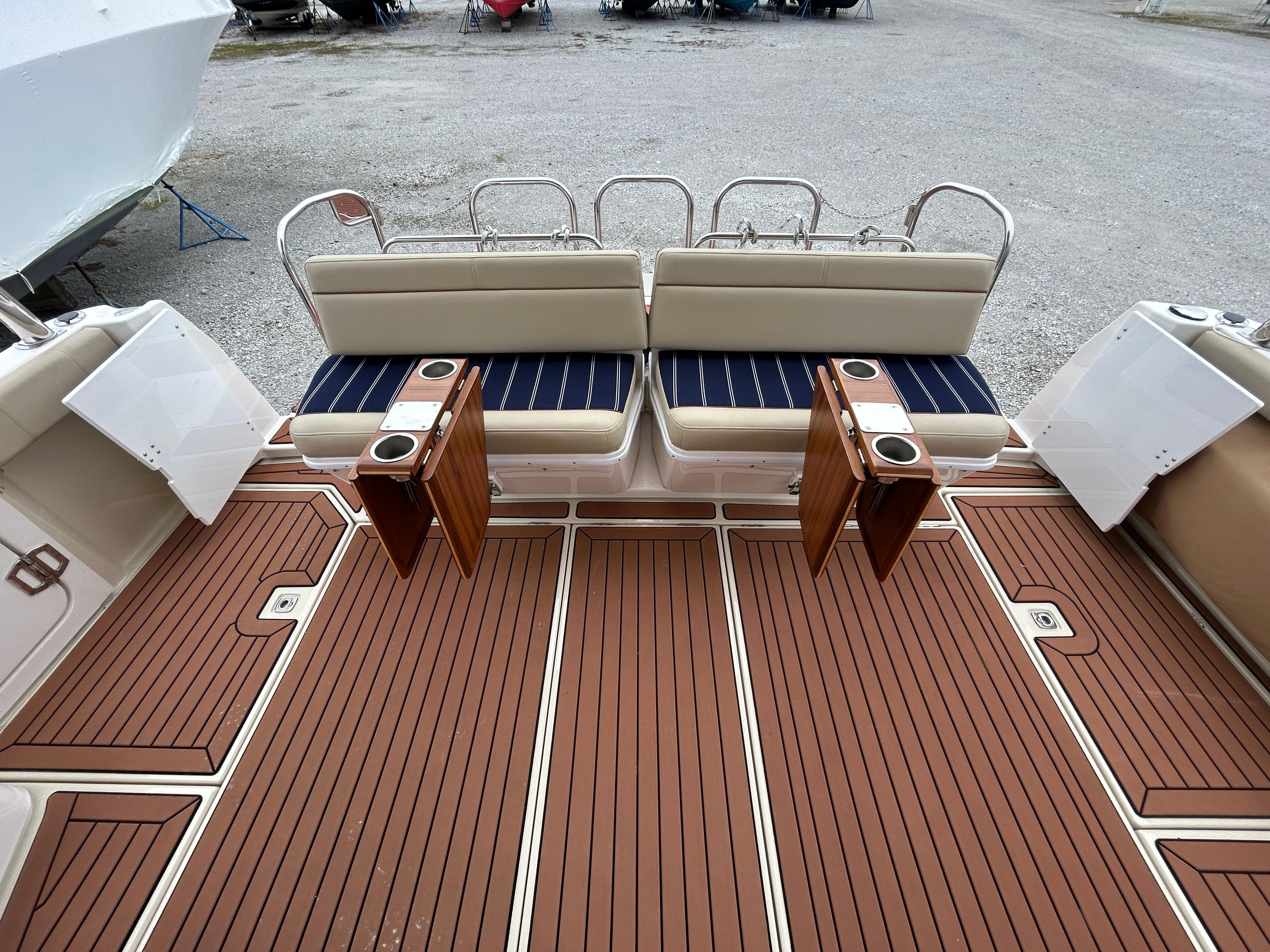 Ranger Tugs-R-43 CB 2023 -MD-US-2023 Ranger Tugs R-43 CB boat deck with cushioned seating and wooden flooring.-9675096 | Thumbnail