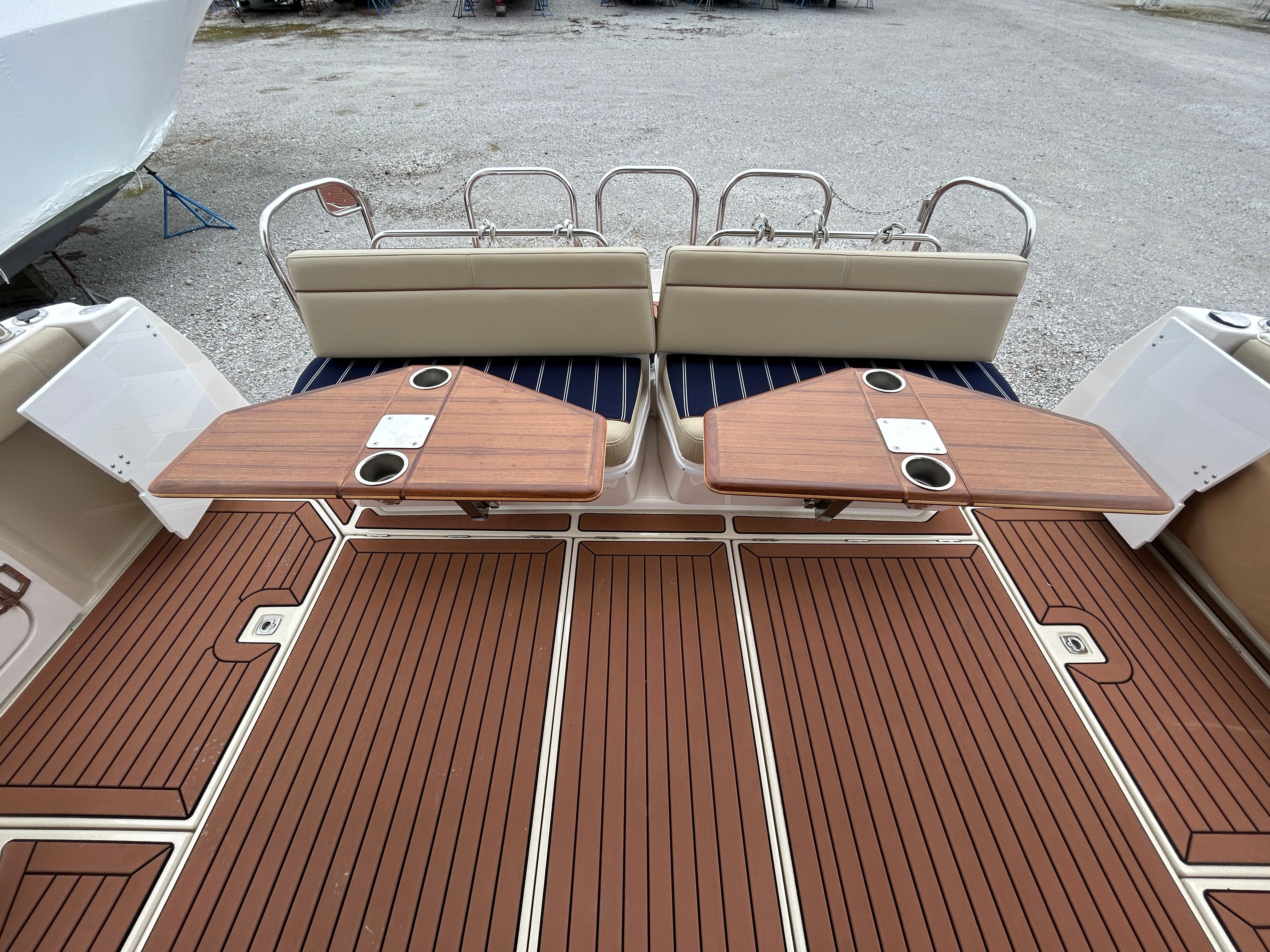 Ranger Tugs-R-43 CB 2023 -MD-US-2023 Ranger Tugs R-43 CB boat deck with wooden flooring and foldable tables.-9675096 | Thumbnail