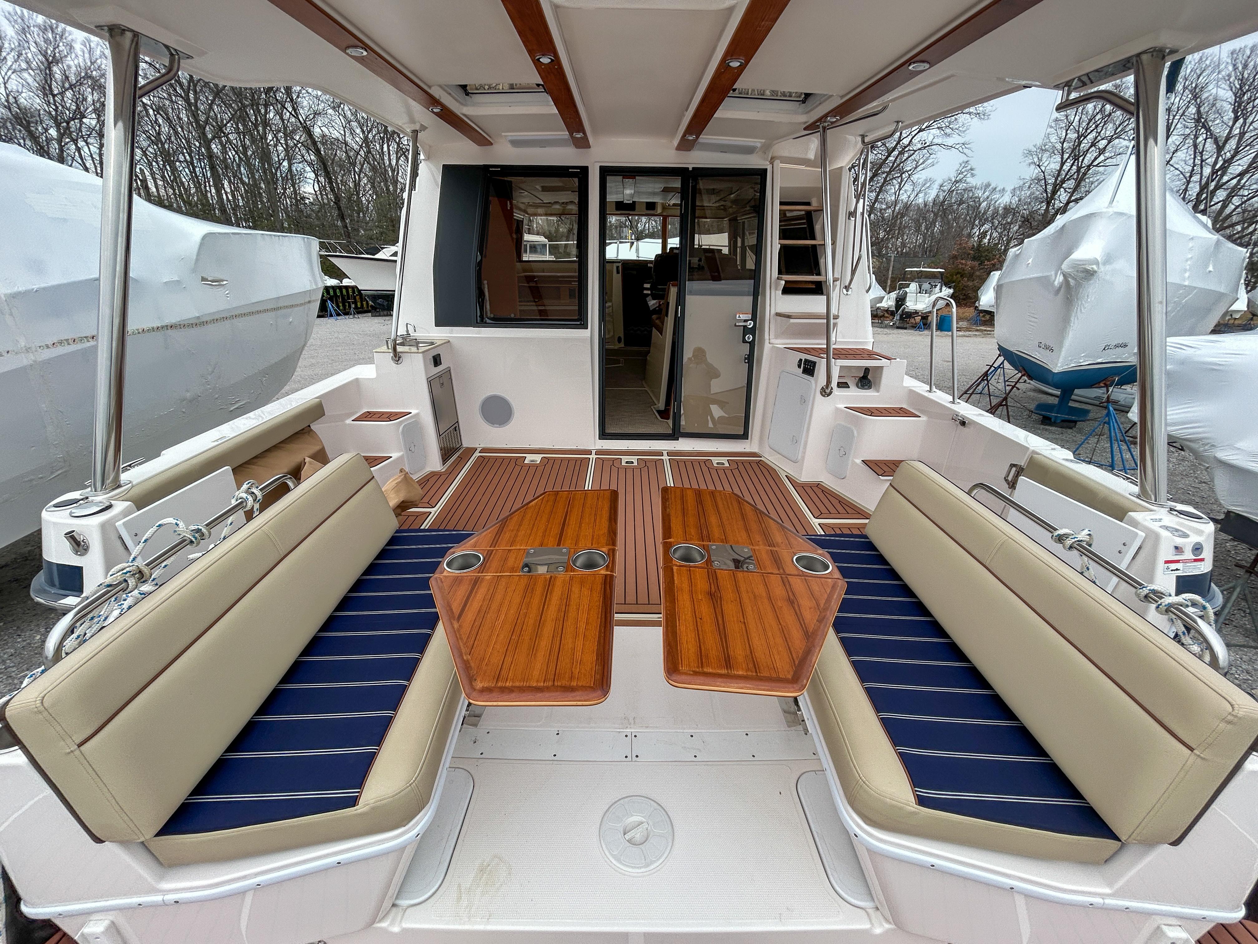 Ranger Tugs-R-43 CB 2023 -MD-US-2023 Ranger Tugs R-43 CB boat interior with seating and wooden tables.-9675096 | Thumbnail