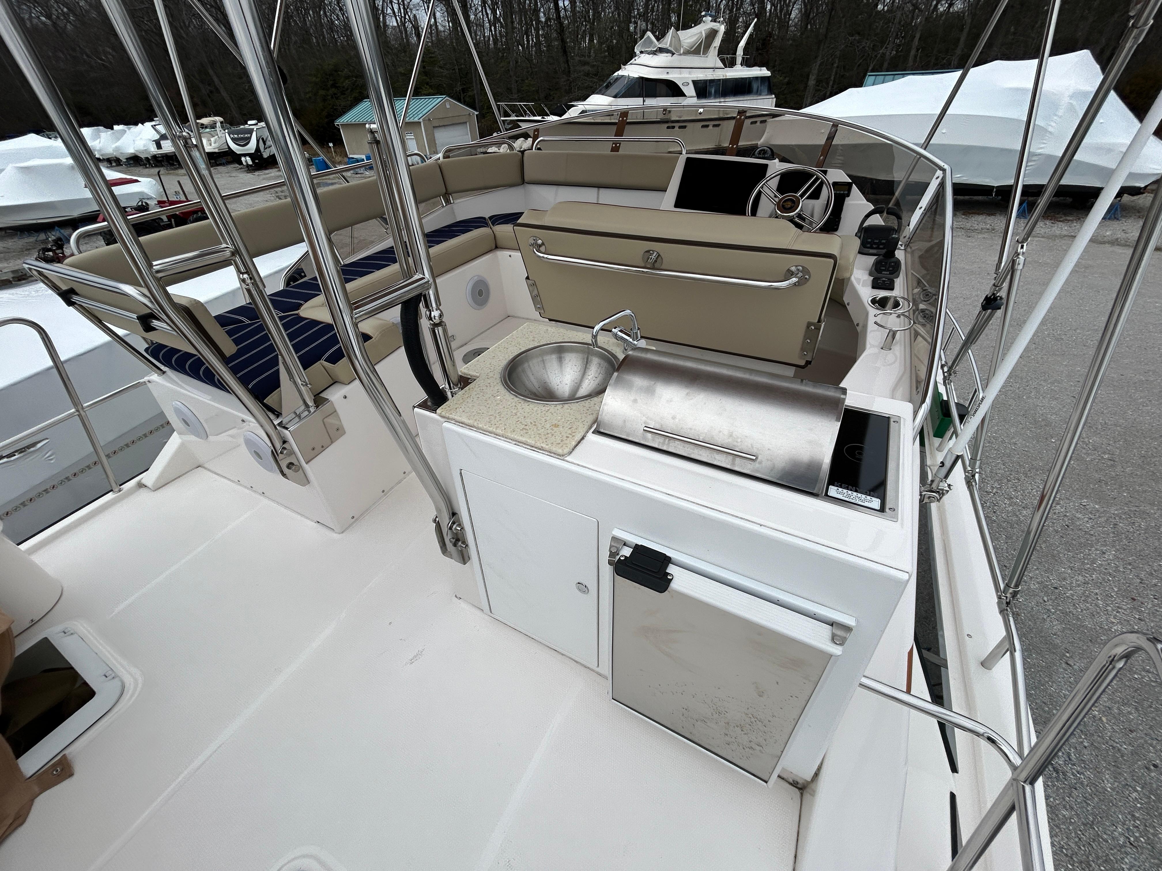 Ranger Tugs-R-43 CB 2023 -MD-US-2023 Ranger Tugs R-43 CB boat deck with sink and seating area.-9675096 | Thumbnail