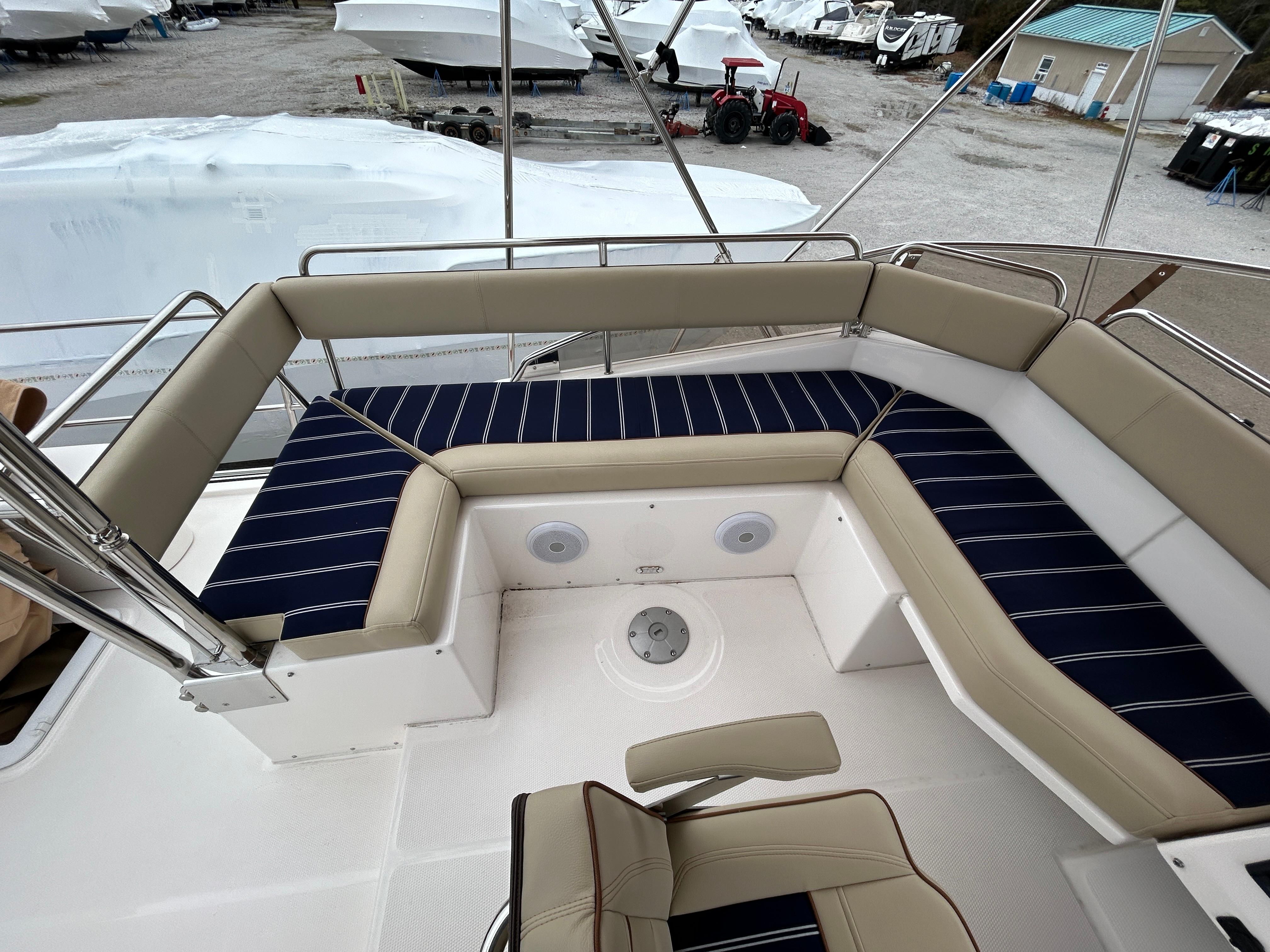 Ranger Tugs-R-43 CB 2023 -MD-US-2023 Ranger Tugs R-43 CB boat deck with cushioned seating and striped upholstery.-9675096 | Thumbnail